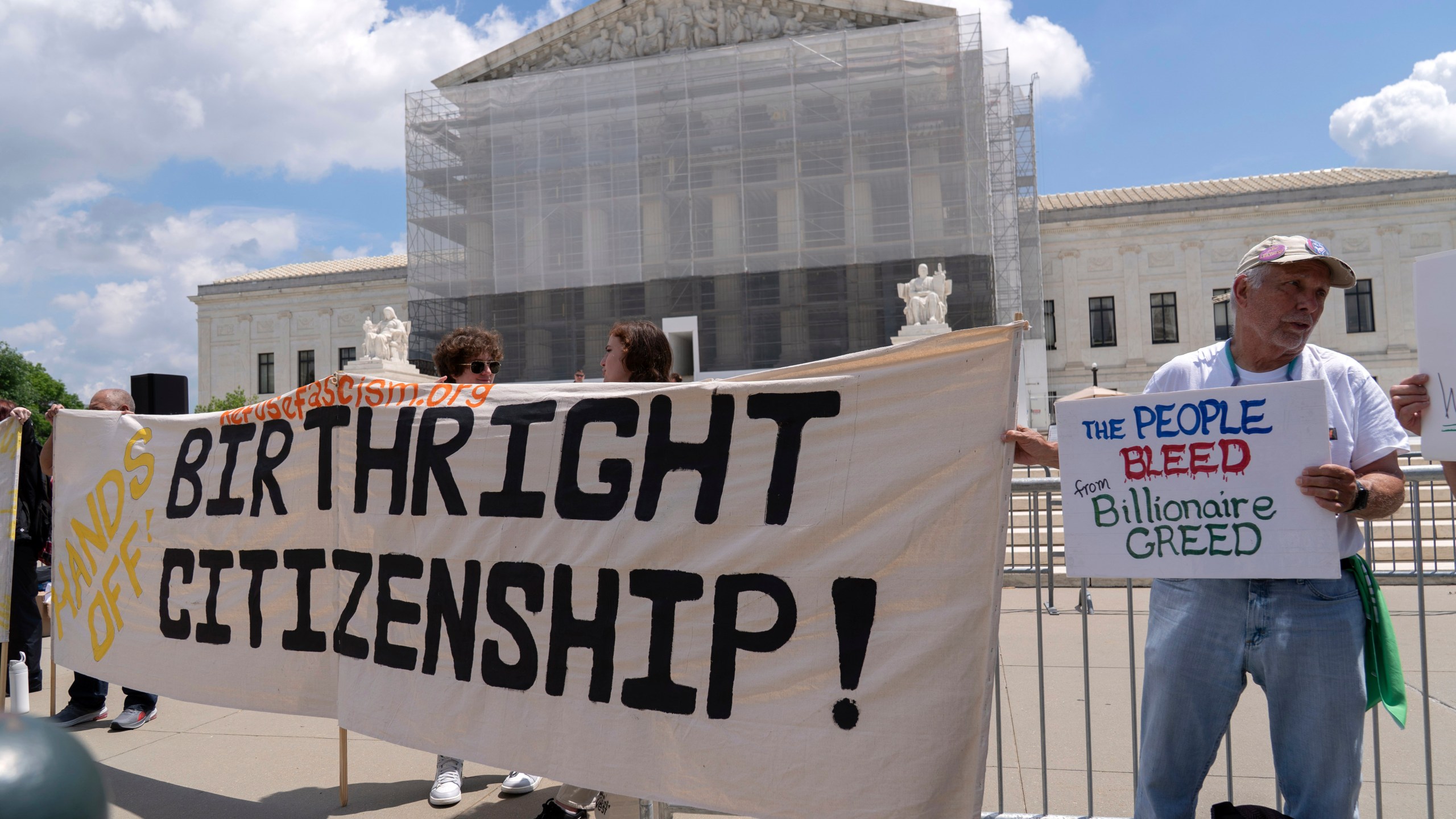 FILE - Demonstrators holds up a banner during a citizenship rally outside of the Supreme Court in Washington, May 15, 2025. (AP Photo/Jose Luis Magana, File)