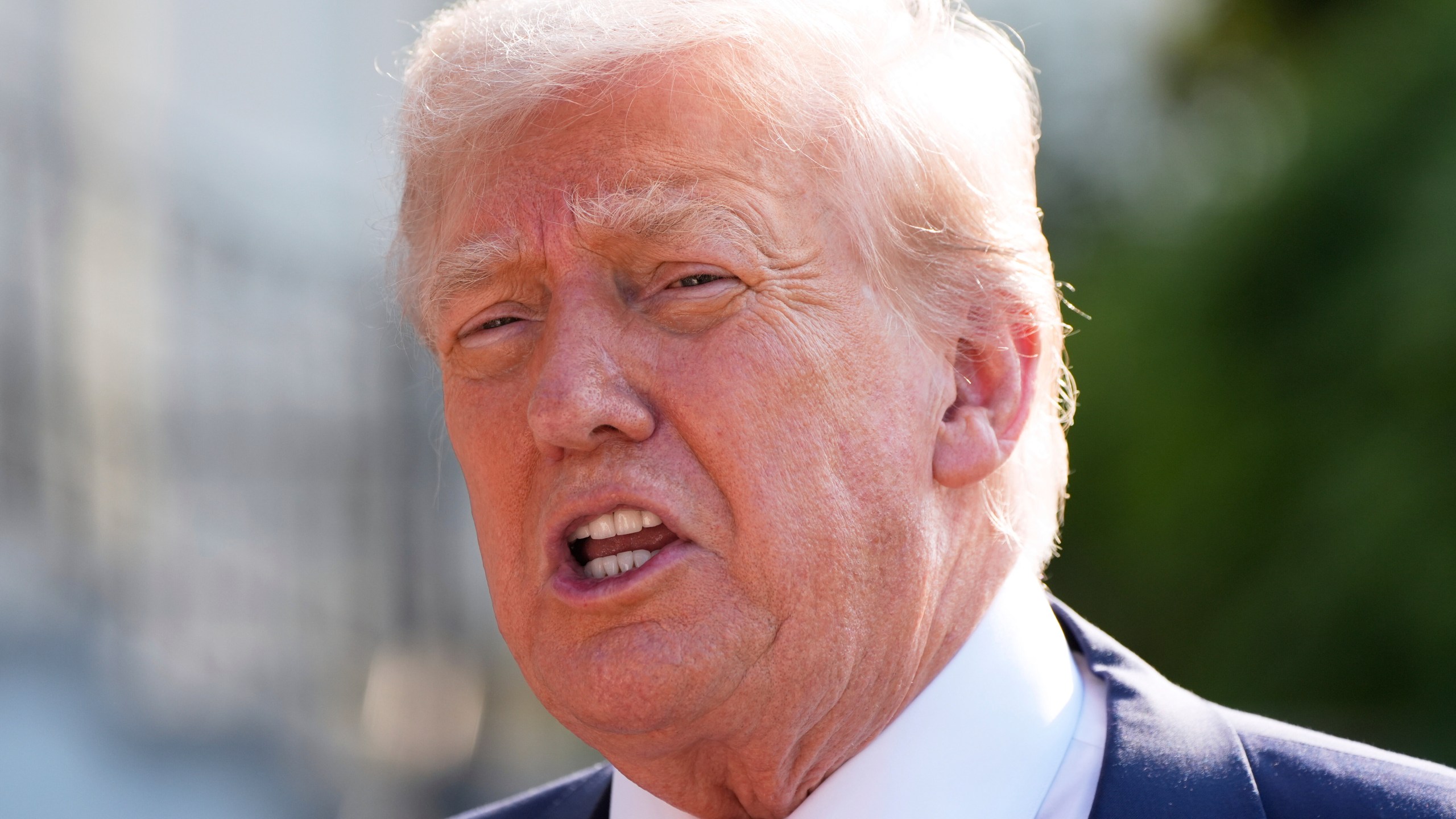 President Donald Trump speaks with reporters before departing on Marine One from the South Lawn of the White House, Friday, July 25, 2025, in Washington. The President is traveling to Scotland. (AP Photo/Alex Brandon)