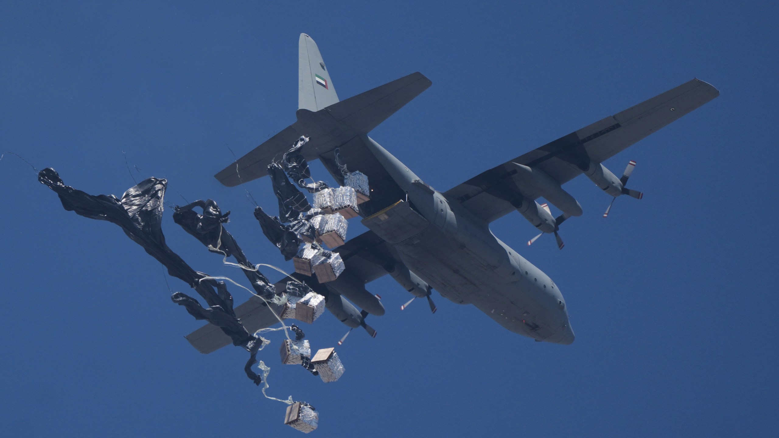 Humanitarian aid is airdropped to Palestinians over Gaza City, Gaza Strip, Sunday, July 27, 2025. (AP Photo/Jehad Alshrafi)