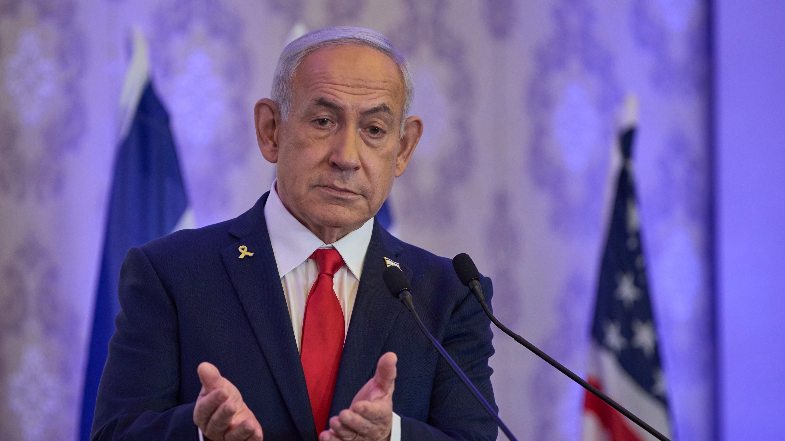 Israeli Prime Minister Benjamin Netanyahu speaks to the audience at a conference in Jerusalem, Sunday, July 27, 2025. (AP Photo/Ohad Zwigenberg)