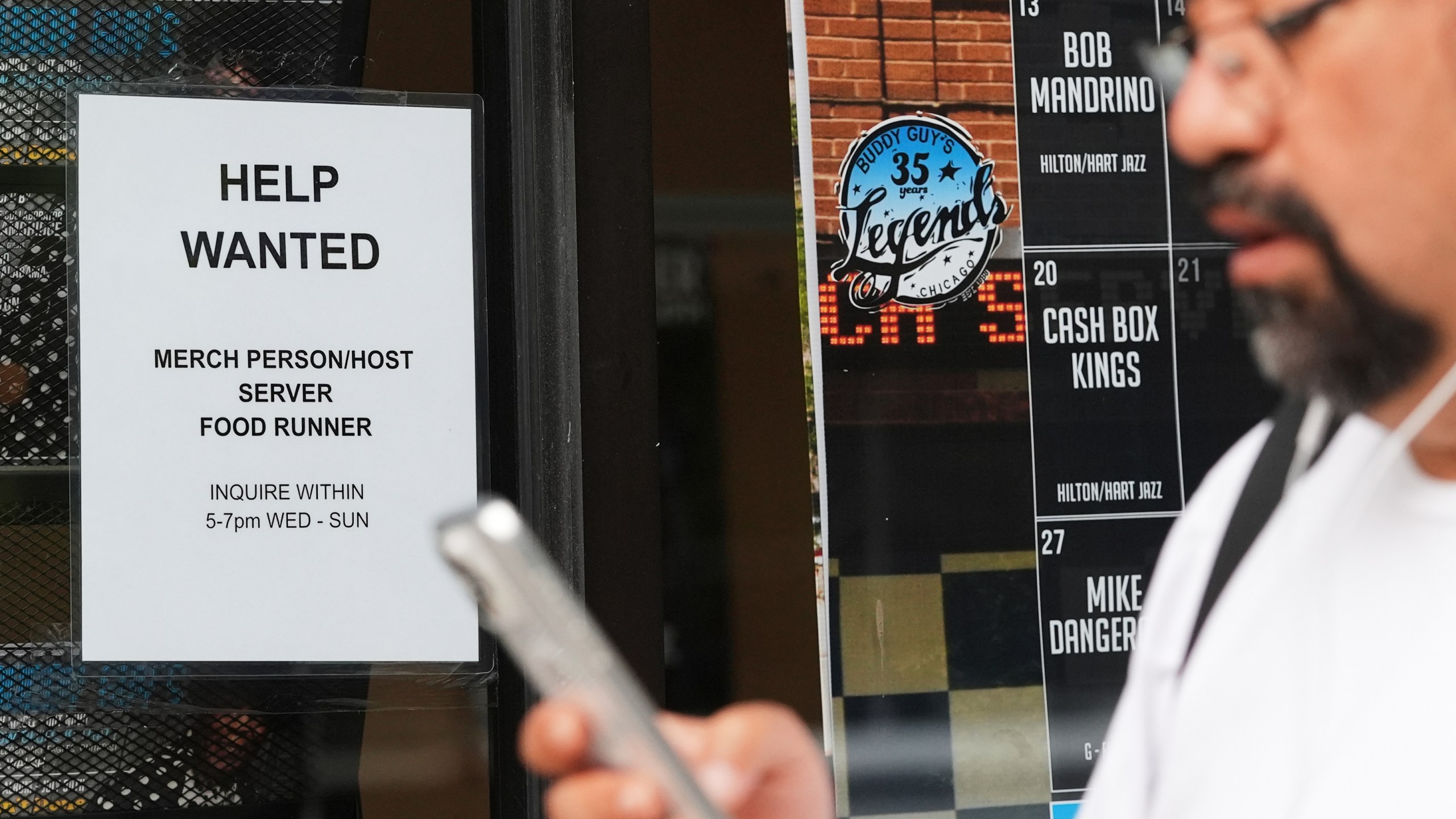 Help wanted sign is displayed at a live music and blues club in Chicago, Thursday, July 24, 2025. (AP Photo/Nam Y. Huh)