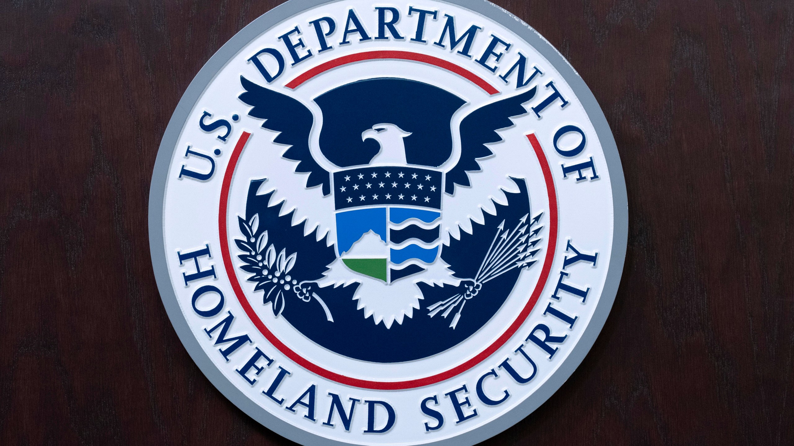 FILE - The seal of U.S. Department of Homeland Security is seen before the news conference with Acting director of U.S. Immigration and Customs Enforcement (ICE) Todd Lyons at ICE Headquarters, in Washington, on May 21, 2025. (AP Photo/Jose Luis Magana, File)