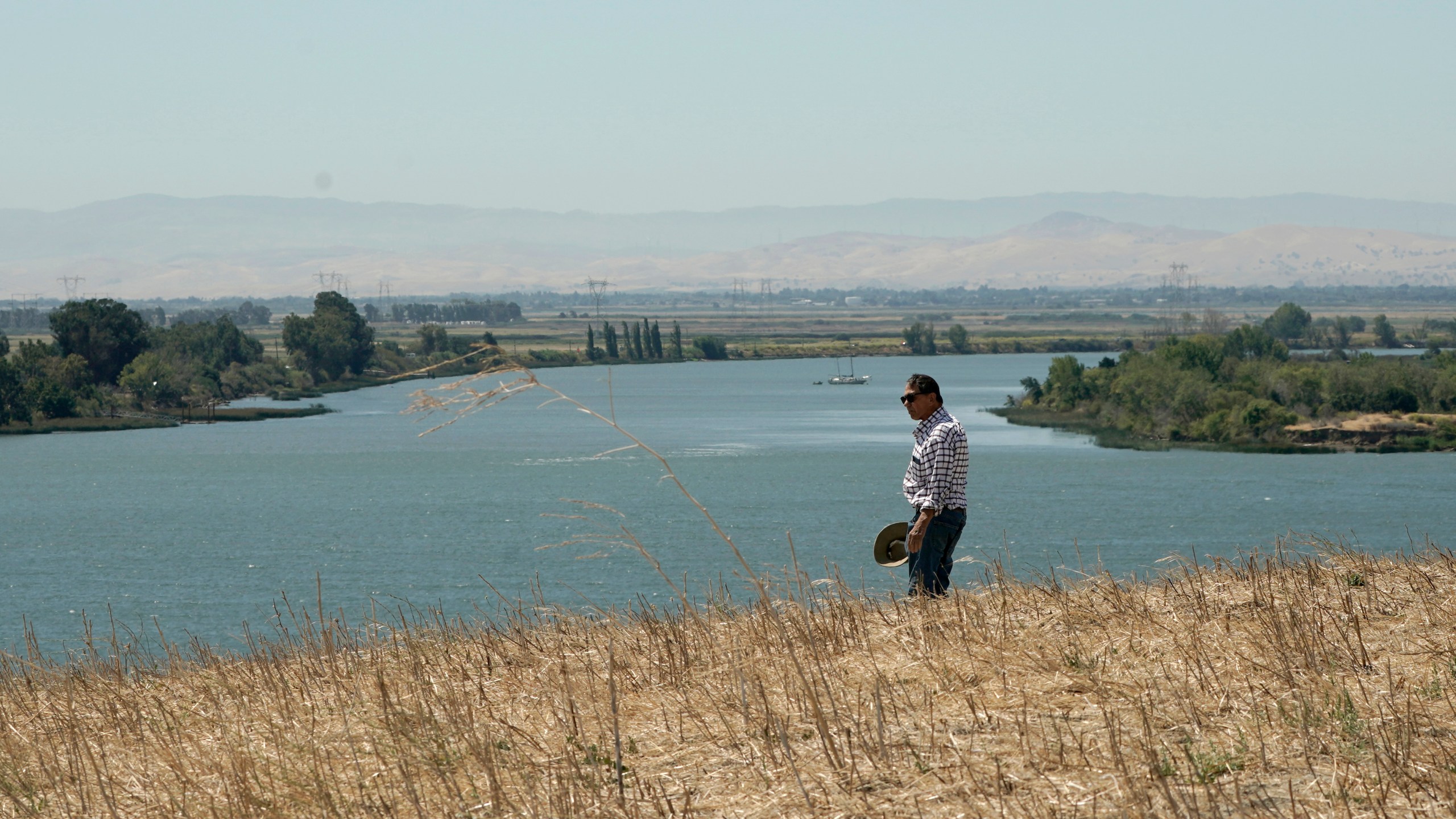 a man looking out over the Sacramento River
