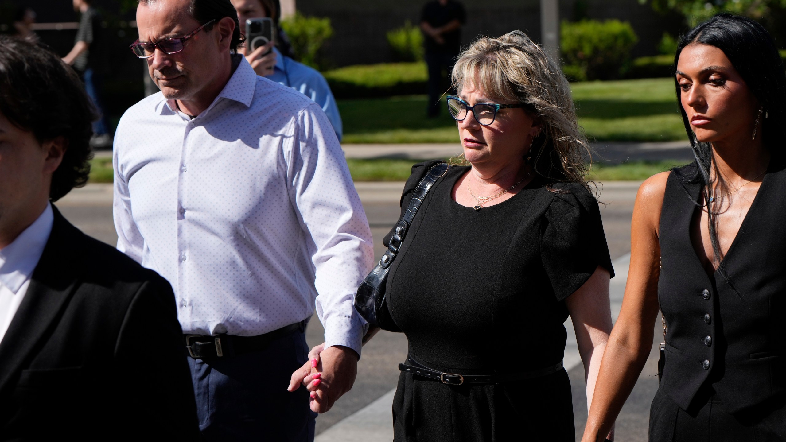 The mother and father of Idaho murder victim Kaylee Goncalves walk to the Ada County Courthouse for Bryan Kohberger's plea deal hearing