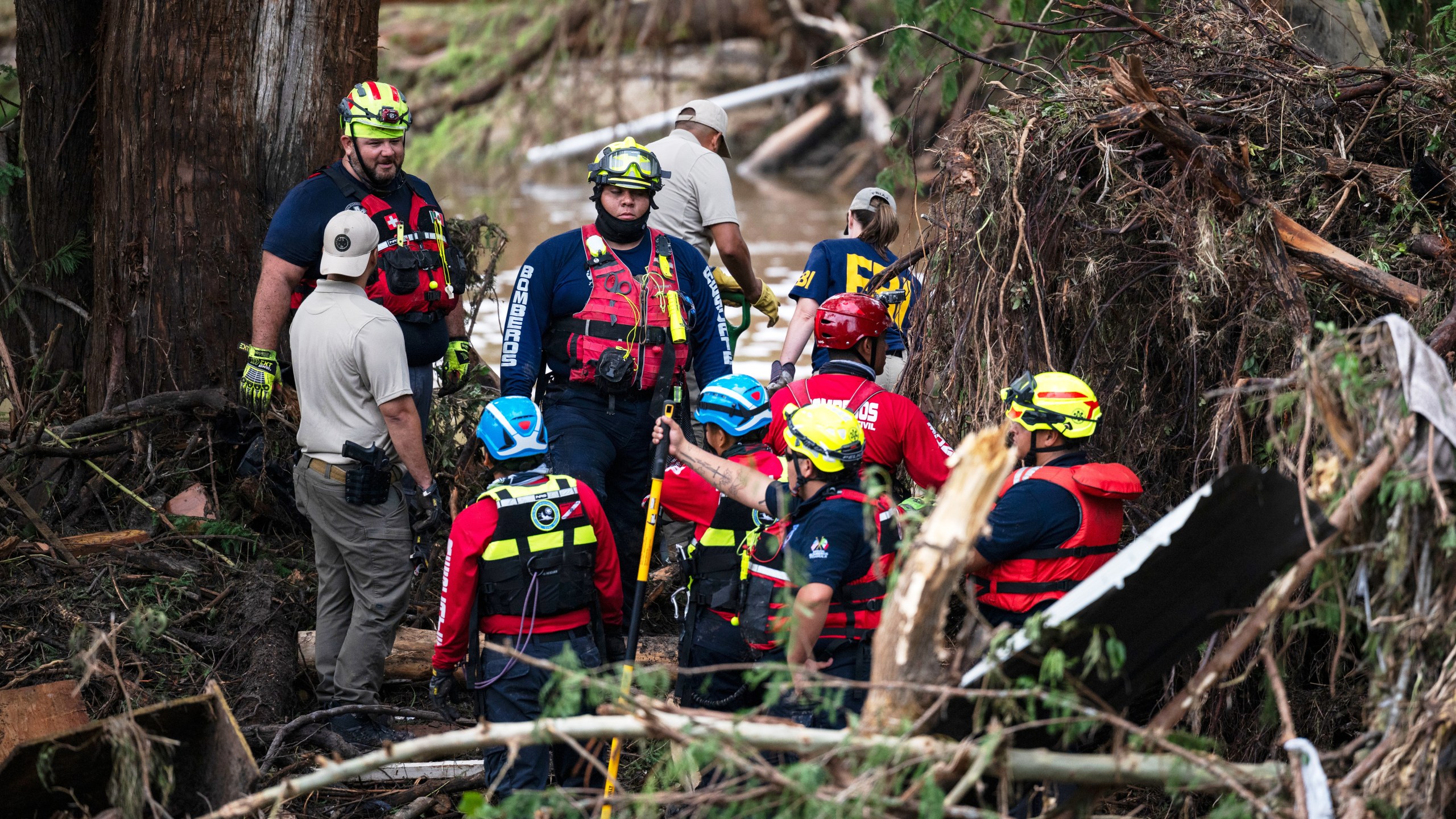 Firefighters aid in search, rescue efforts near a river
