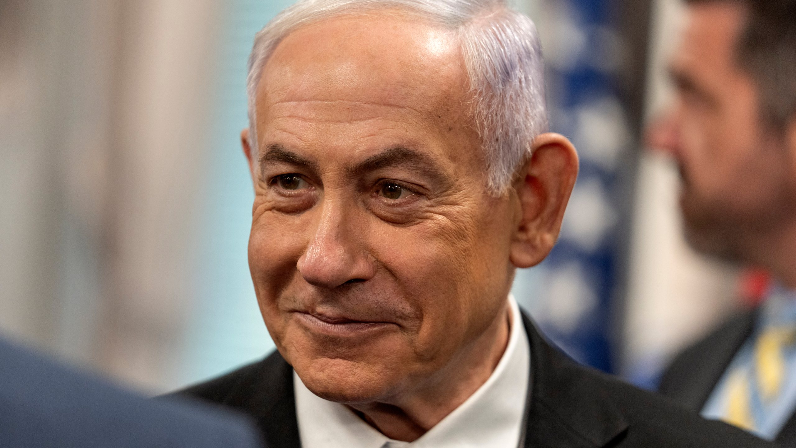 Israeli Prime Minister Benjamin Netanyahu smiles during a meeting