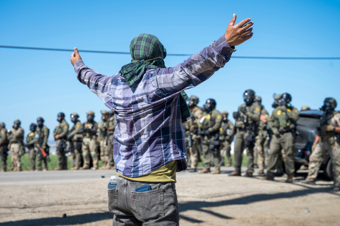 Protesters standoff against federal immigration agents during a raid in the agriculture area of Camarillo, Calif., Thursday, July 10, 2025