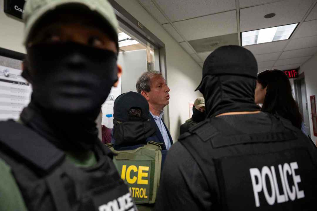 New York City Comptroller Brad Lander talks to federal agents outside immigration court