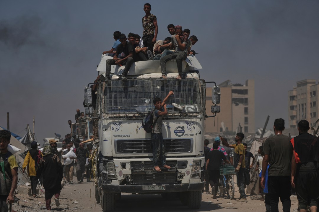 Palestinians carry sacks of flour
