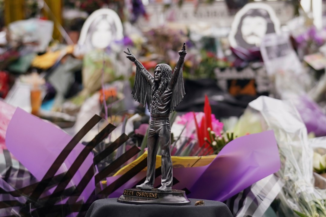 Tributes left in front of the 'Black Sabath bridge' to honour musician Ozzy Osbourne as thousands of fans gathered to watch a funeral procession for Black Sabbath frontman Ozzy Osbourne following his death aged 76, in Birmingham, England, Wednesday, July 30, 2025. (AP Photo/Alberto Pezzali)