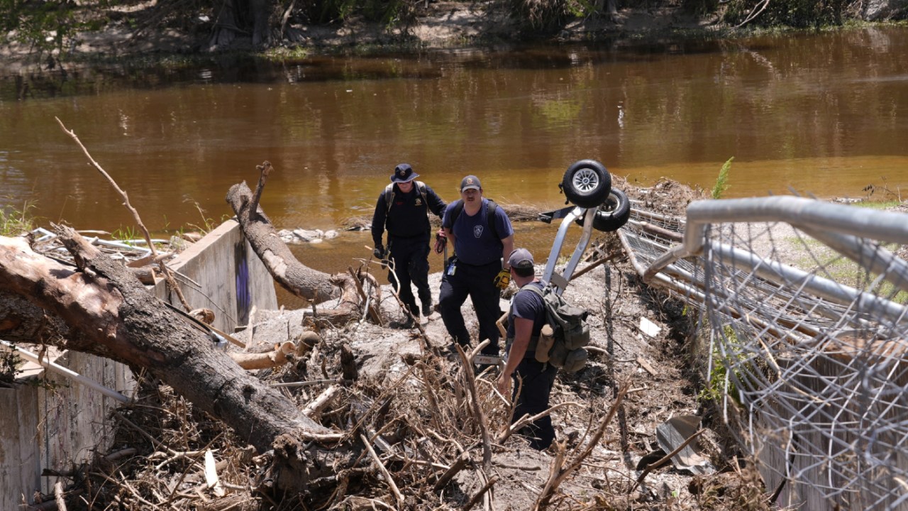 Kerrville Fire department staff search along the river