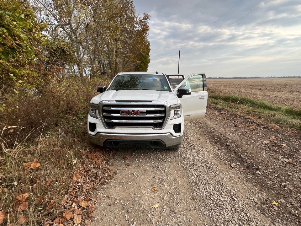 white truck with doors open