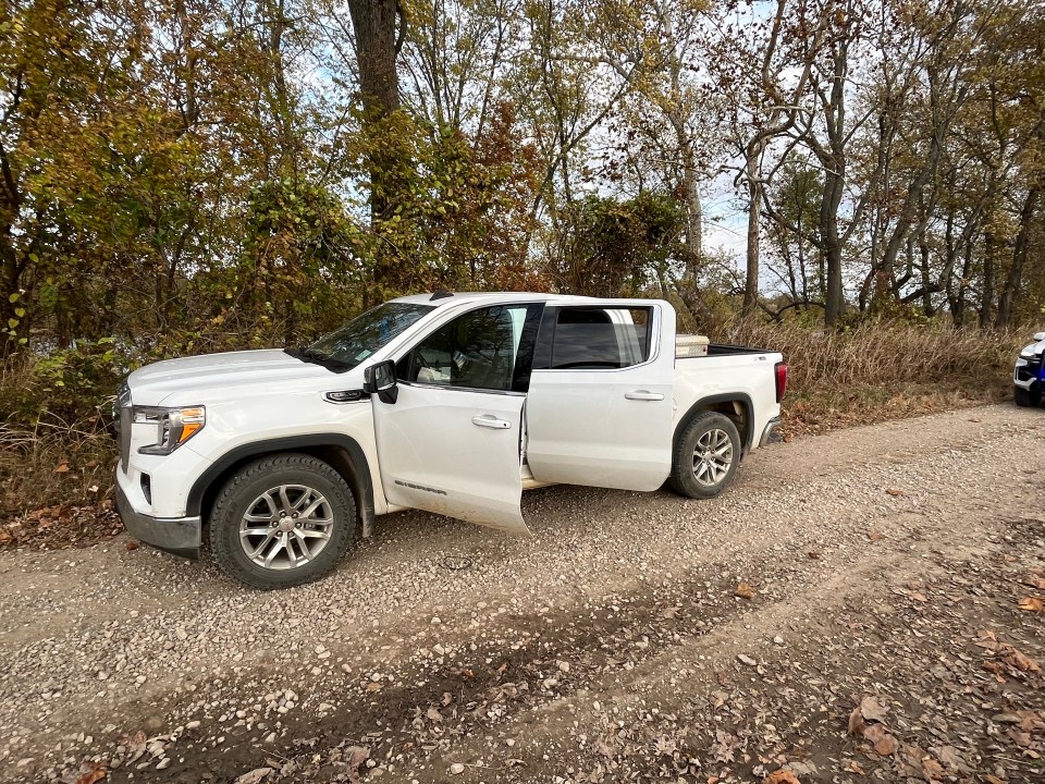 White truck with two open doors