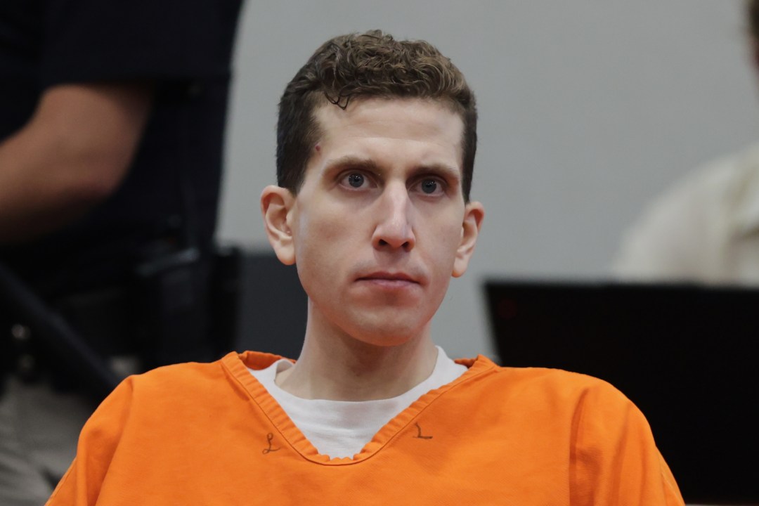 Bryan Kohberger sits in court wearing an orange jumpsuit