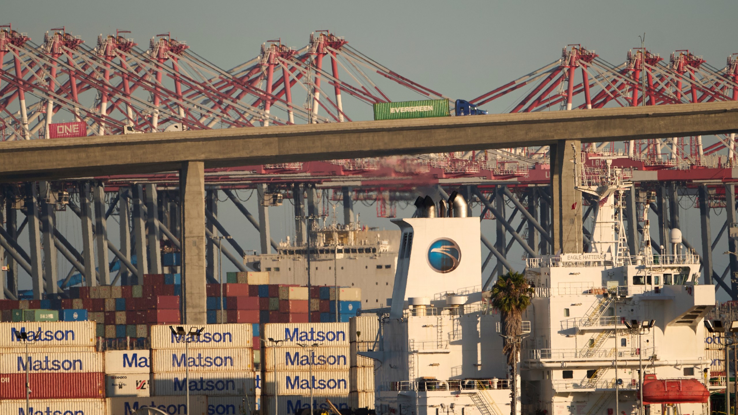Shipping containers are stacked at the Matson terminal in the Port of Long Beach, Calif.,Thursday, July 31, 2025. (AP Photo/Damian Dovarganes)