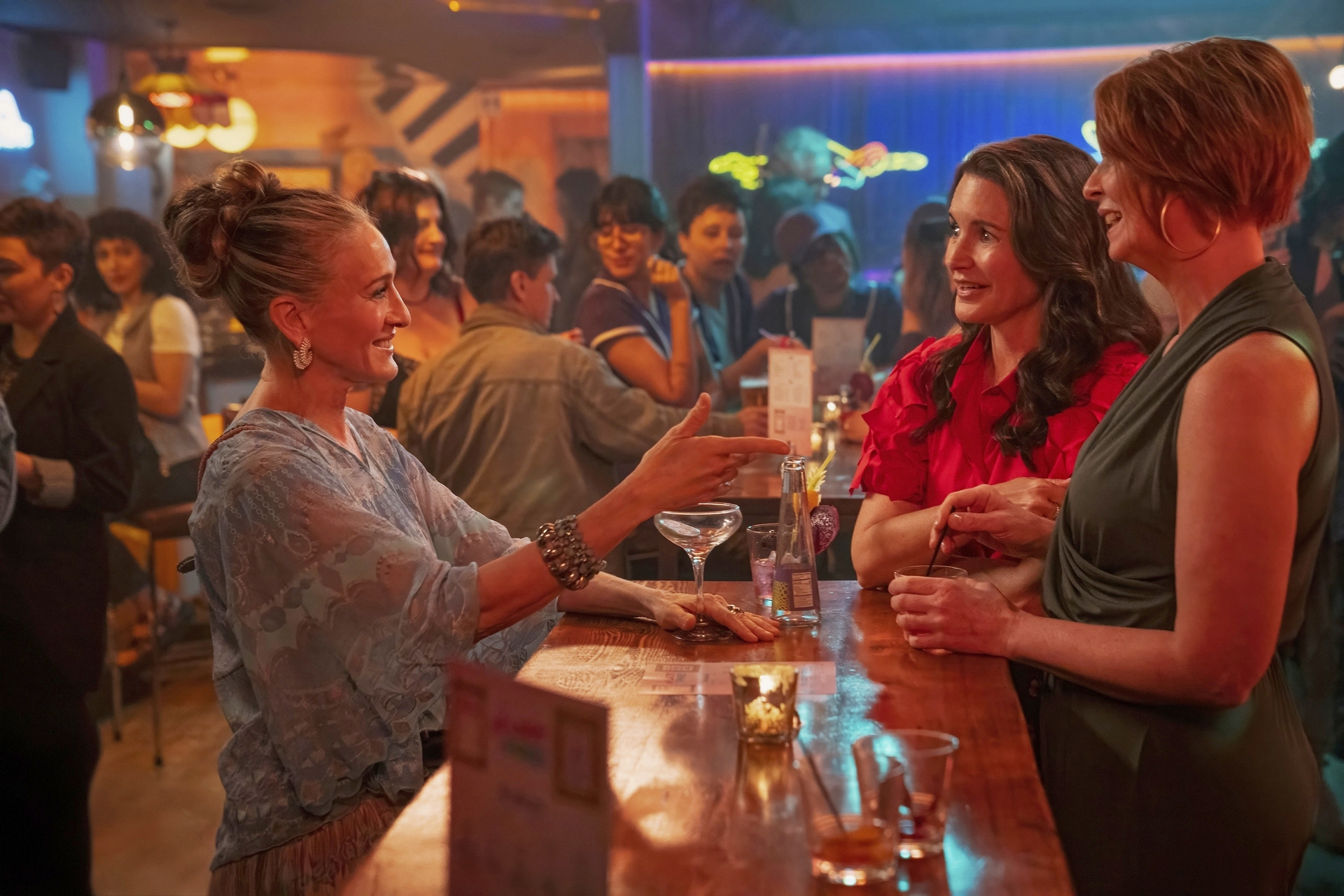 This image released by HBO shows Sarah Jessica Parker, from left, Kristin Davis and Cynthia Nixon from the series "And Just Like That." (Craig Blankenhorn/HBO via AP)