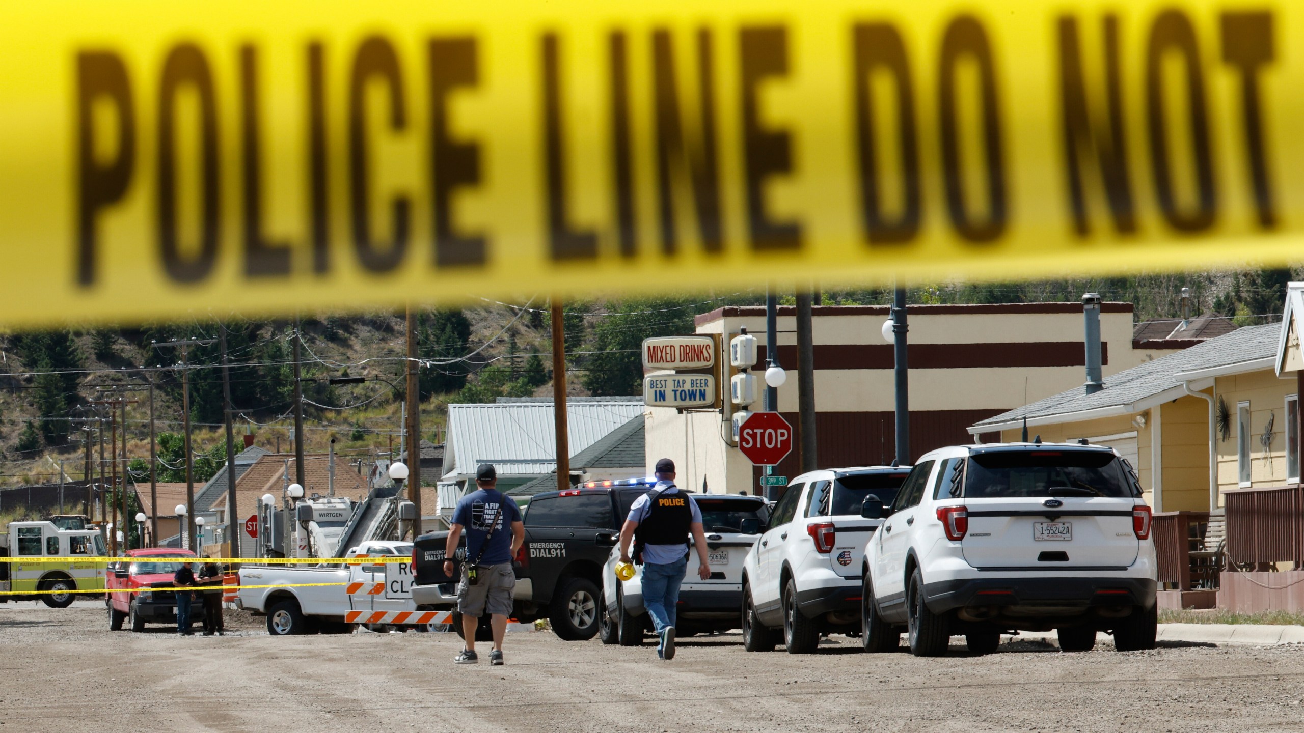 Police and other emergency personnel are seen after a reported shooting in Anaconda, Mont., Friday, Aug. 1, 2025. (Joseph Scheller/The Montana Standard via AP)