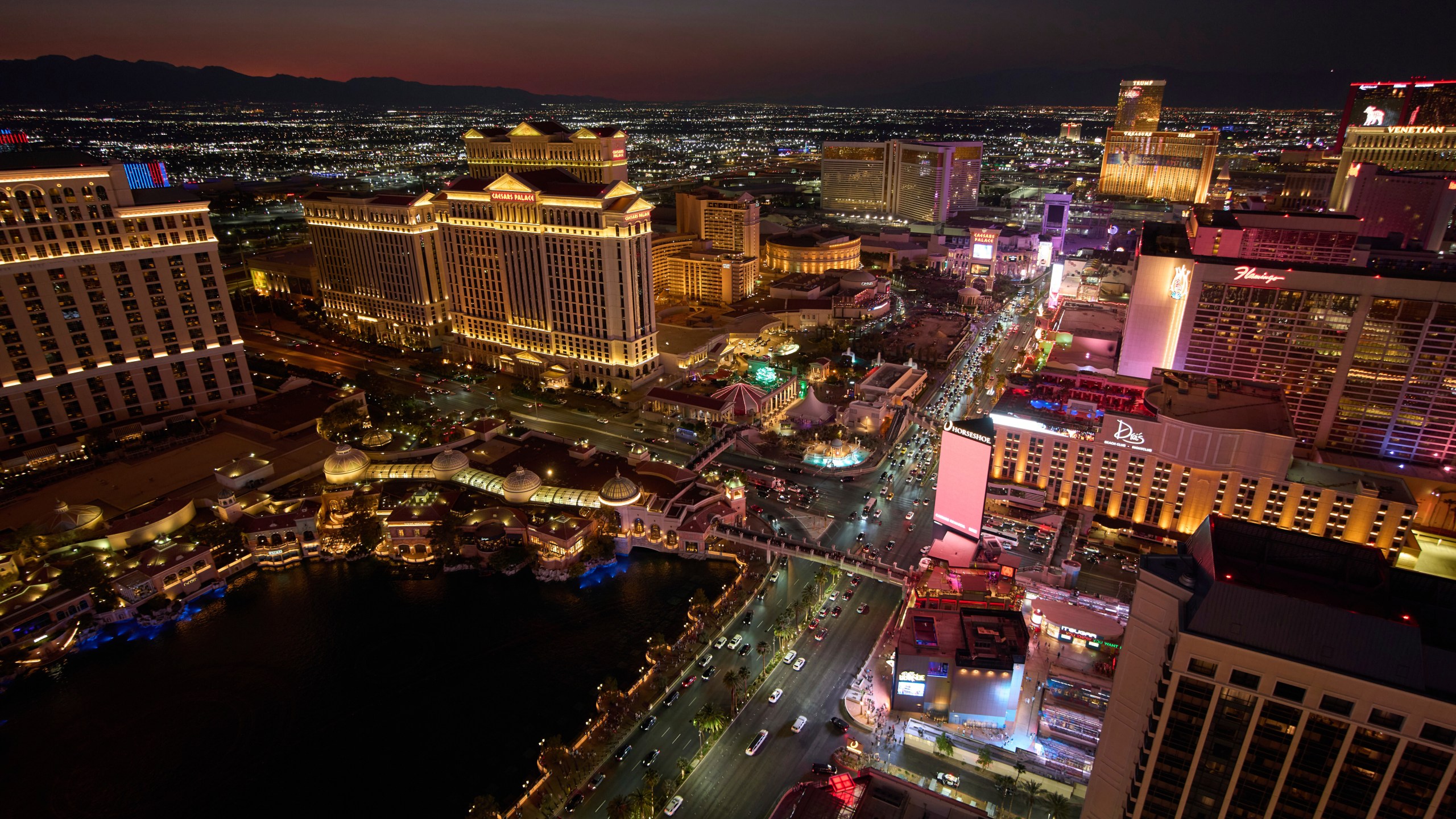 Cars drive along the Las Vegas Strip, Saturday, Aug. 2, 2025, in Las Vegas. (AP Photo/John Locher)