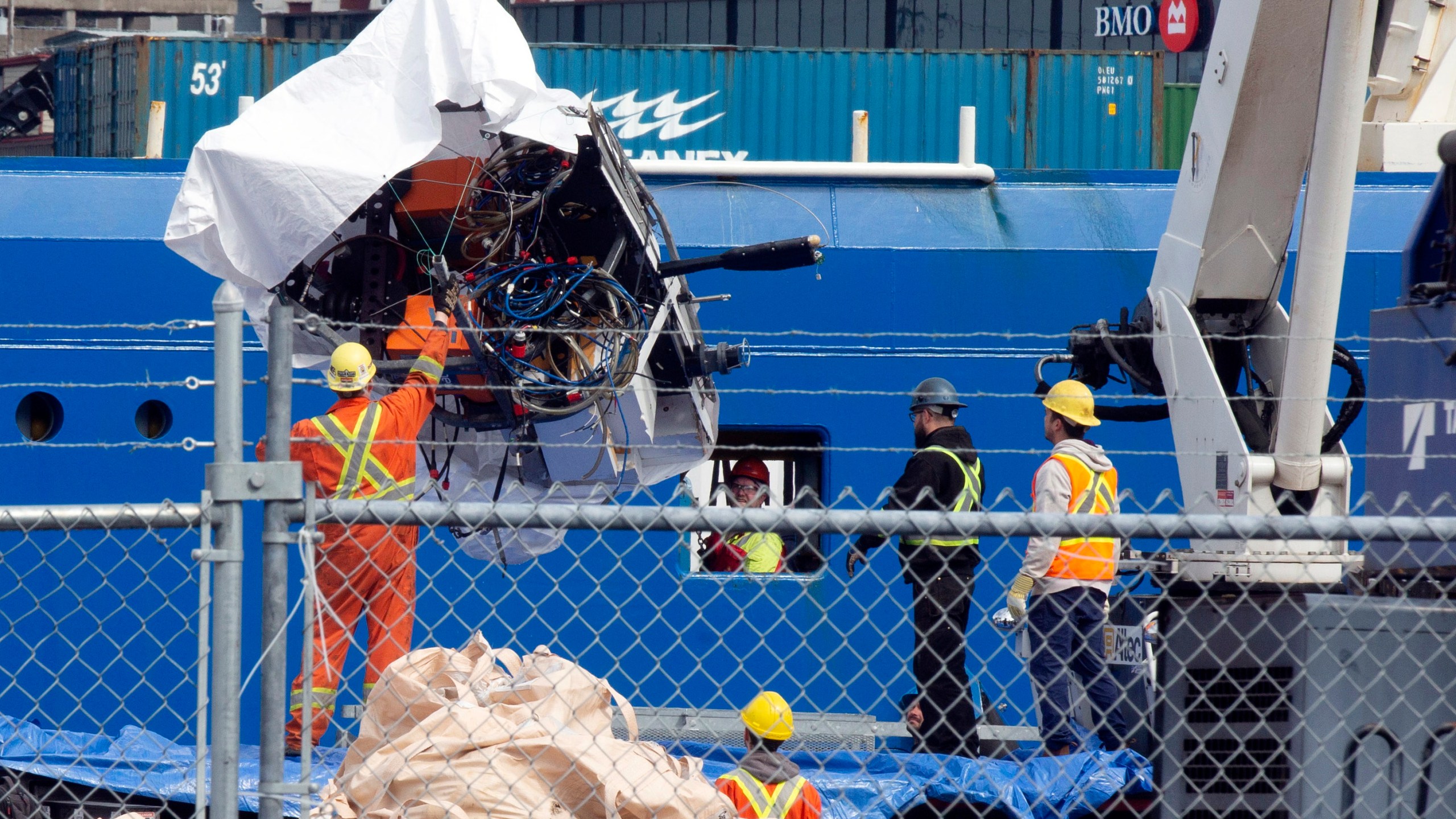 FILE - Debris from the Titan submersible, recovered from the ocean floor near the wreck of the Titanic, is unloaded from the ship Horizon Arctic at the Canadian Coast Guard pier in St. John's, Newfoundland, Wednesday, June 28, 2023. (Paul Daly/The Canadian Press via AP, File)