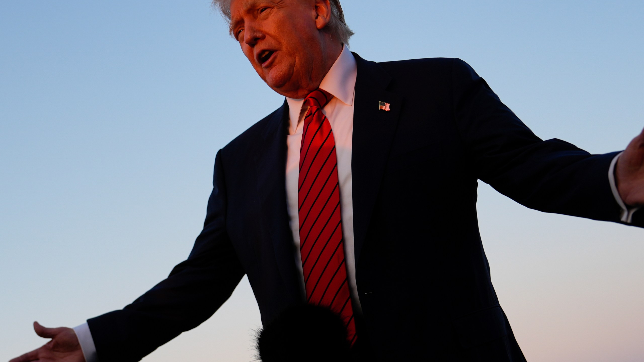 President Donald Trump speaks with reporters before boarding Air Force One at Lehigh Valley International Airport, Sunday, Aug. 3, 2025, in Allentown, Pa. (AP Photo/Julia Demaree Nikhinson)