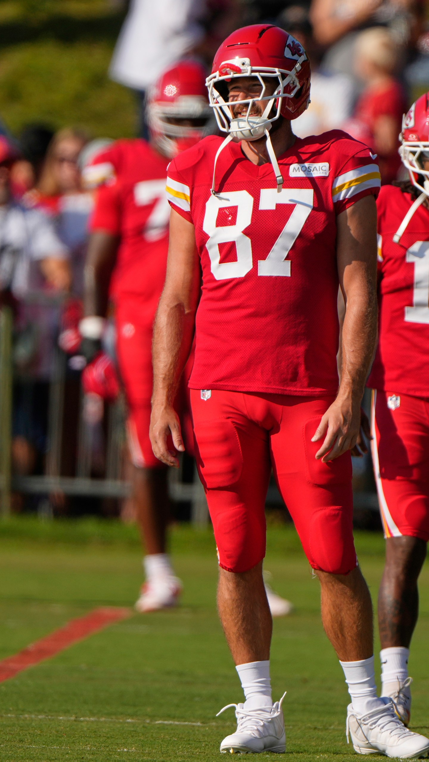 Kansas City Chiefs tight end Travis Kelce (87) waits to stretch at NFL football training camp Tuesday, Aug. 5, 2025, in St. Joseph, Mo. (AP Photo/Charlie Riedel)