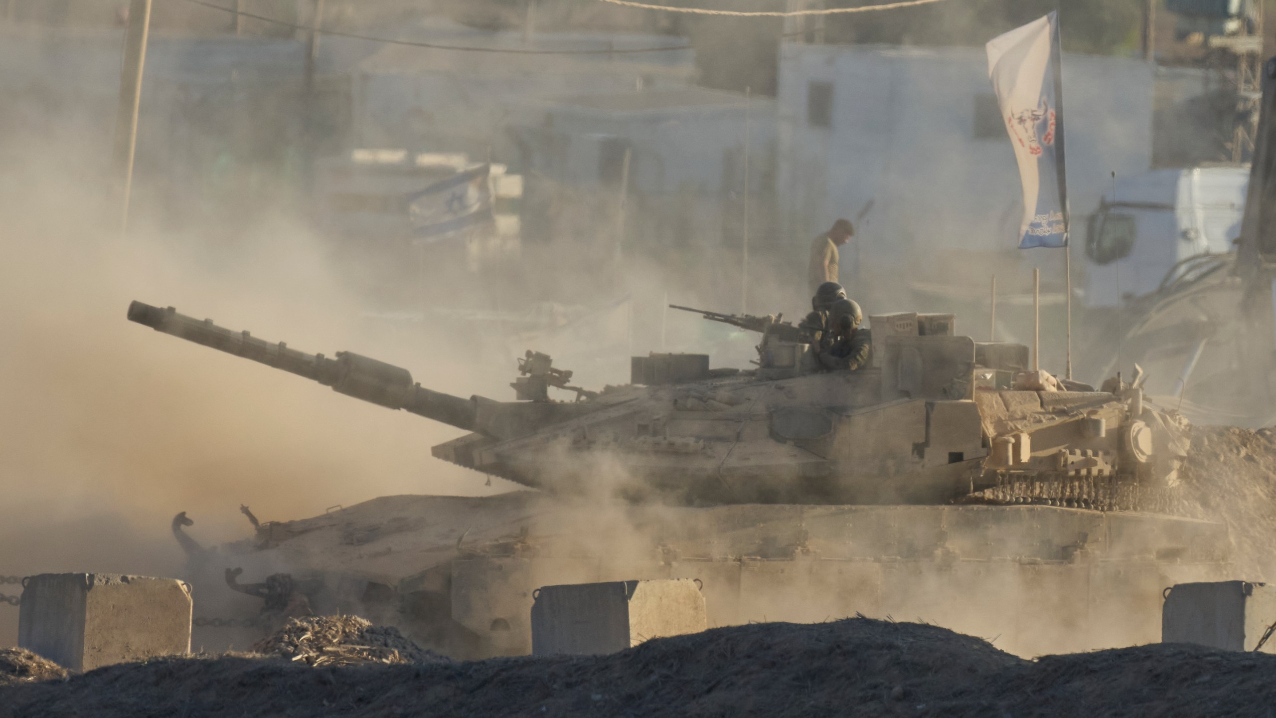 An Israeli tank moves near the border of the Gaza Strip in southern Israel, Wednesday, Aug. 6, 2025. (AP Photo/Ohad Zwigenberg)