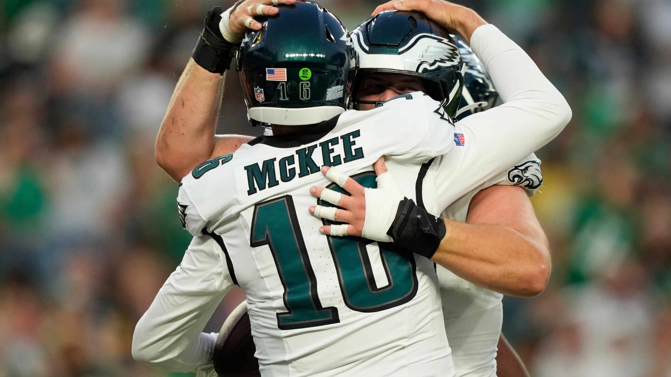 Philadelphia Eagles quarterback Tanner McKee (16) celebrates his touchdown with teammates during the first half of an NFL preseason football game against the Cincinnati Bengals on Thursday, Aug. 7, 2025, in Philadelphia. (AP Photo/Matt Slocum)