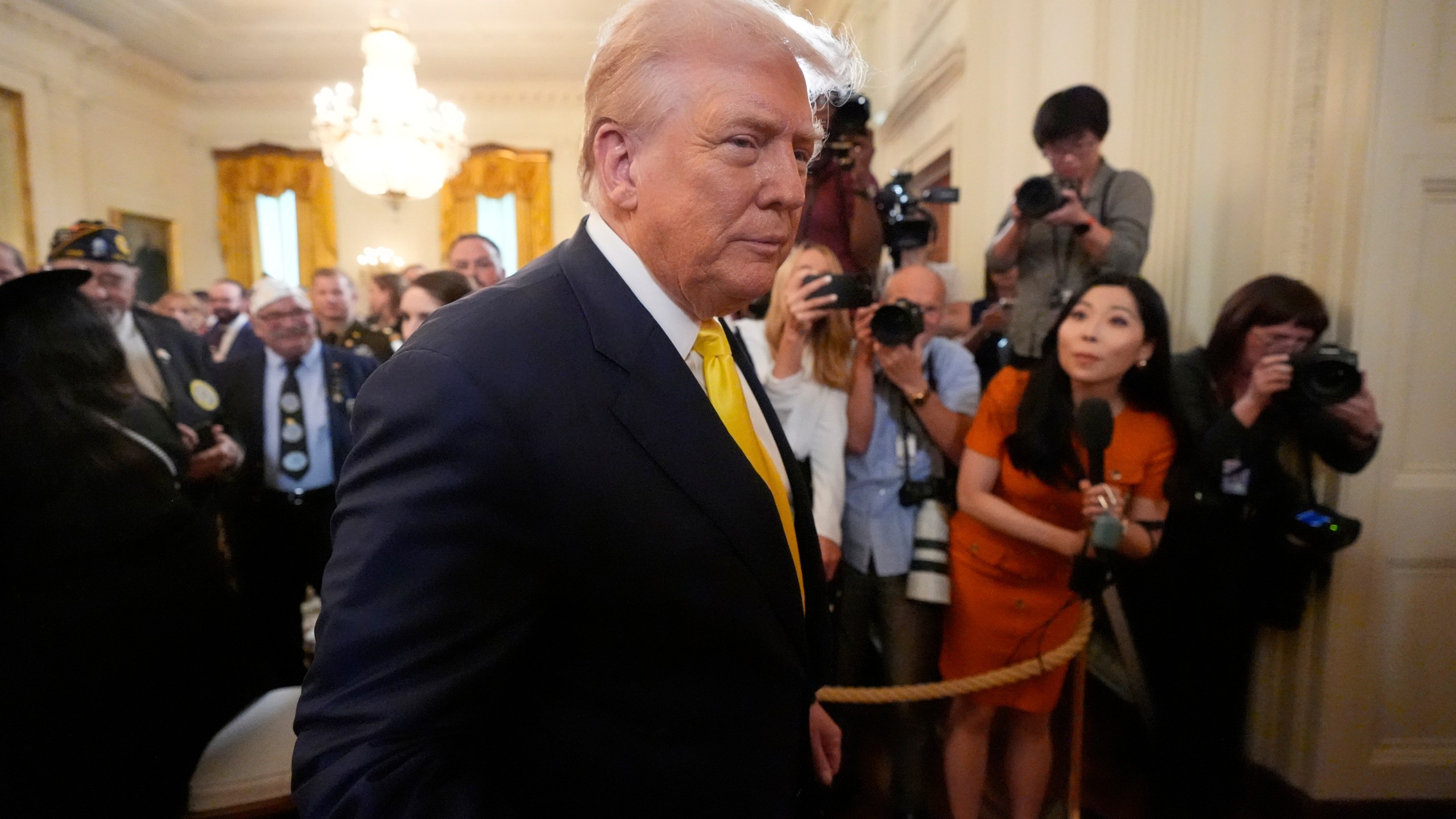 President Donald Trump departs an event to mark National Purple Heart Day in the East Room of the White House, Thursday, Aug. 7, 2025, in Washington. (AP Photo/Mark Schiefelbein)