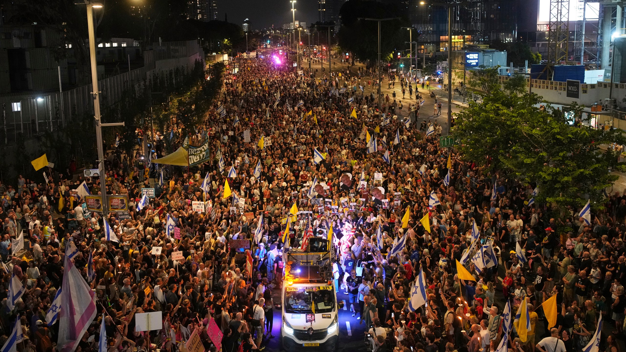 Relatives and supporters of Israeli hostages held in the Gaza Strip attend a rally demanding their release from Hamas captivity and calling for an end to the war, in Tel Aviv, Israel, Saturday, Aug. 9, 2025. (AP Photo/Ohad Zwigenberg)