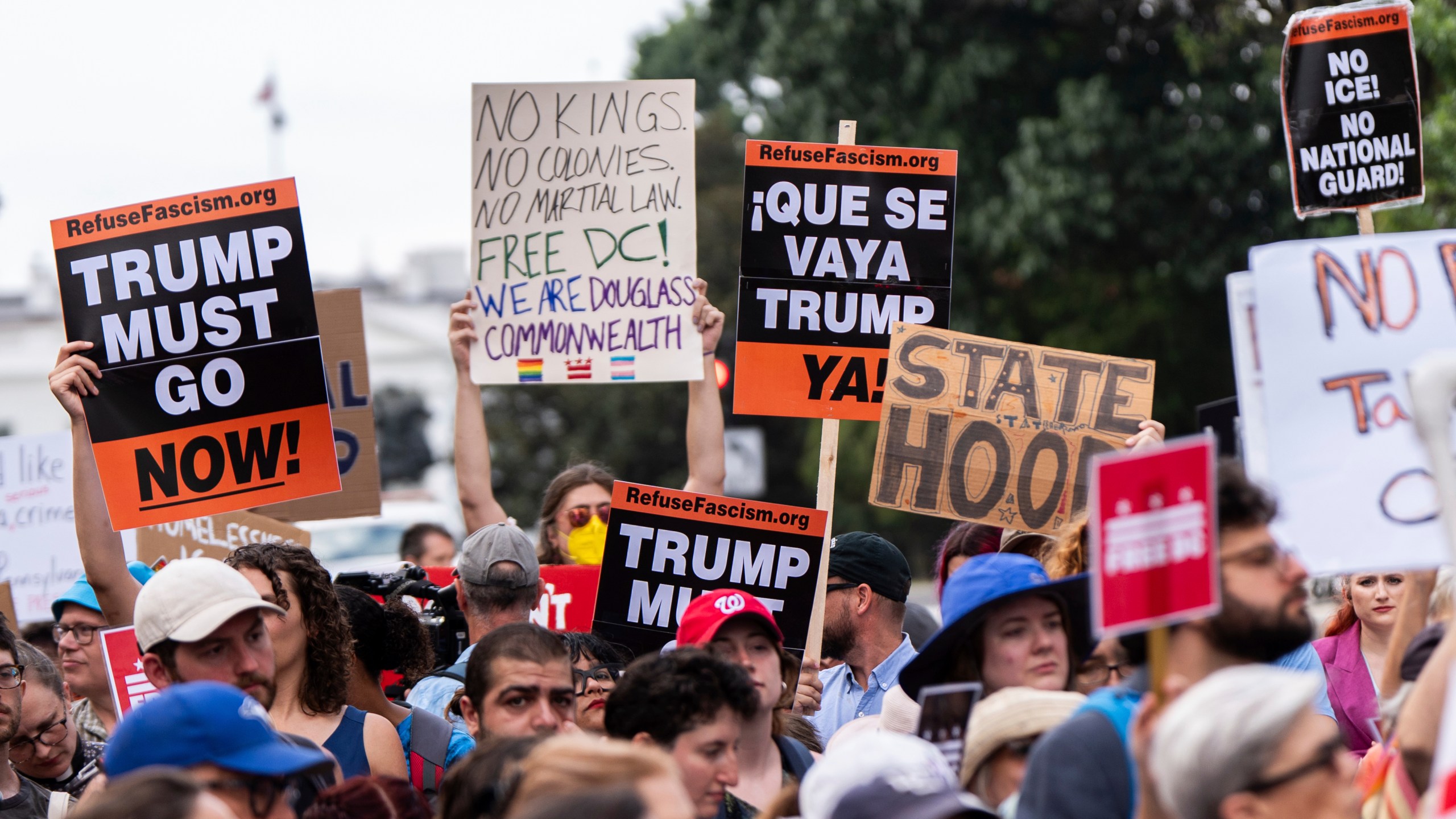 Protesters demonstrate against President Donald Trump's planned use of federal law enforcement and National Guard troops in Washington, during a rally in front of the White House, Monday, Aug. 11, 2025, in Washington. (AP Photo/Julia Demaree Nikhinson)