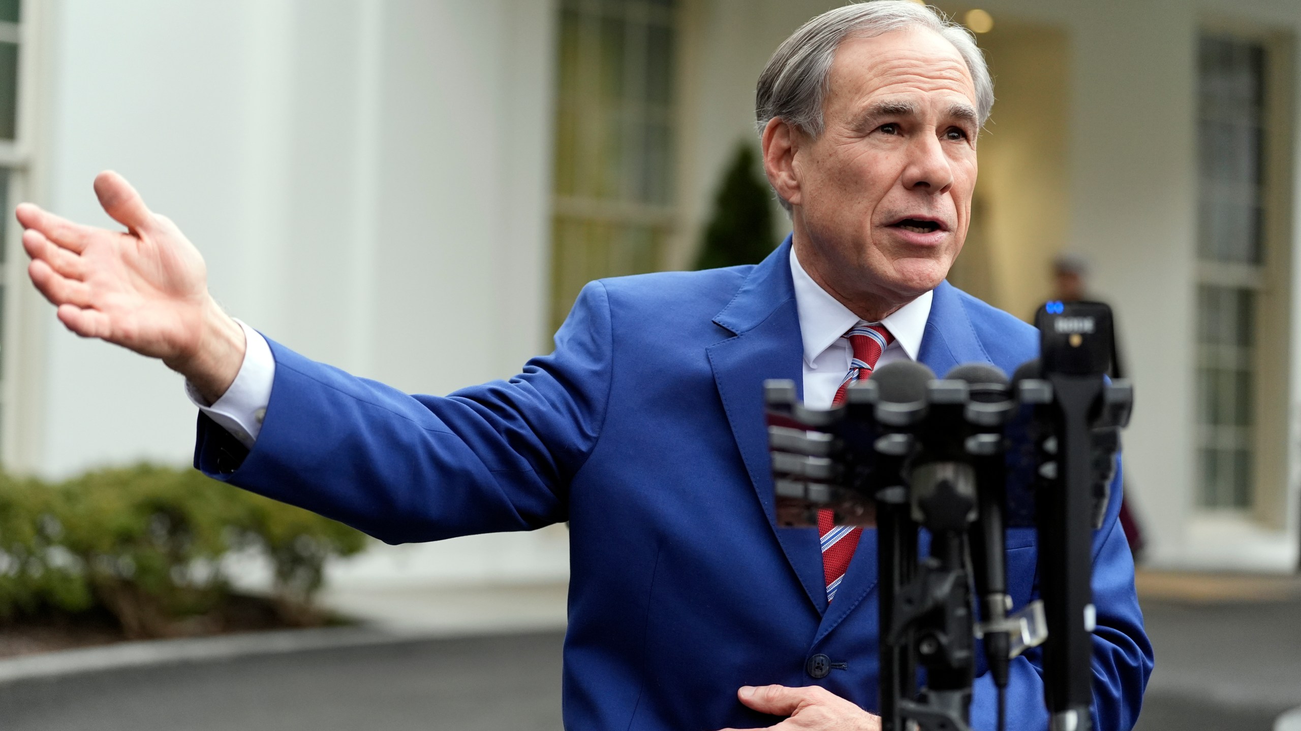 FILE - Texas Gov. Greg Abbott speaks to reporters outside the West Wing of the White House, Feb. 5, 2025, in Washington. (AP Photo/Alex Brandon, File)