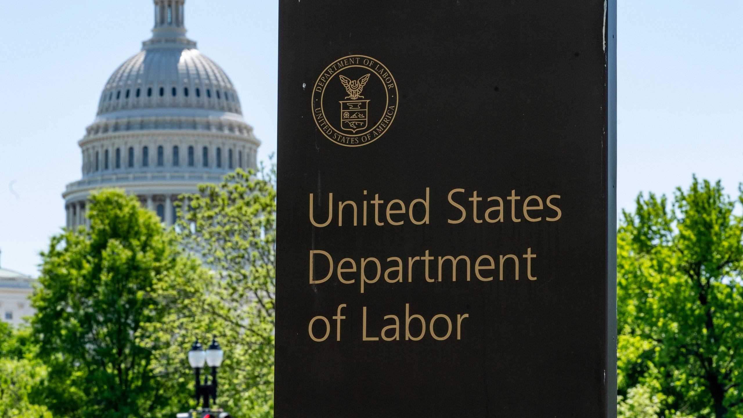 FILE - The entrance to the Labor Department is seen near the Capitol in Washington, May 7, 2020. (AP Photo/J. Scott Applewhite, File)
