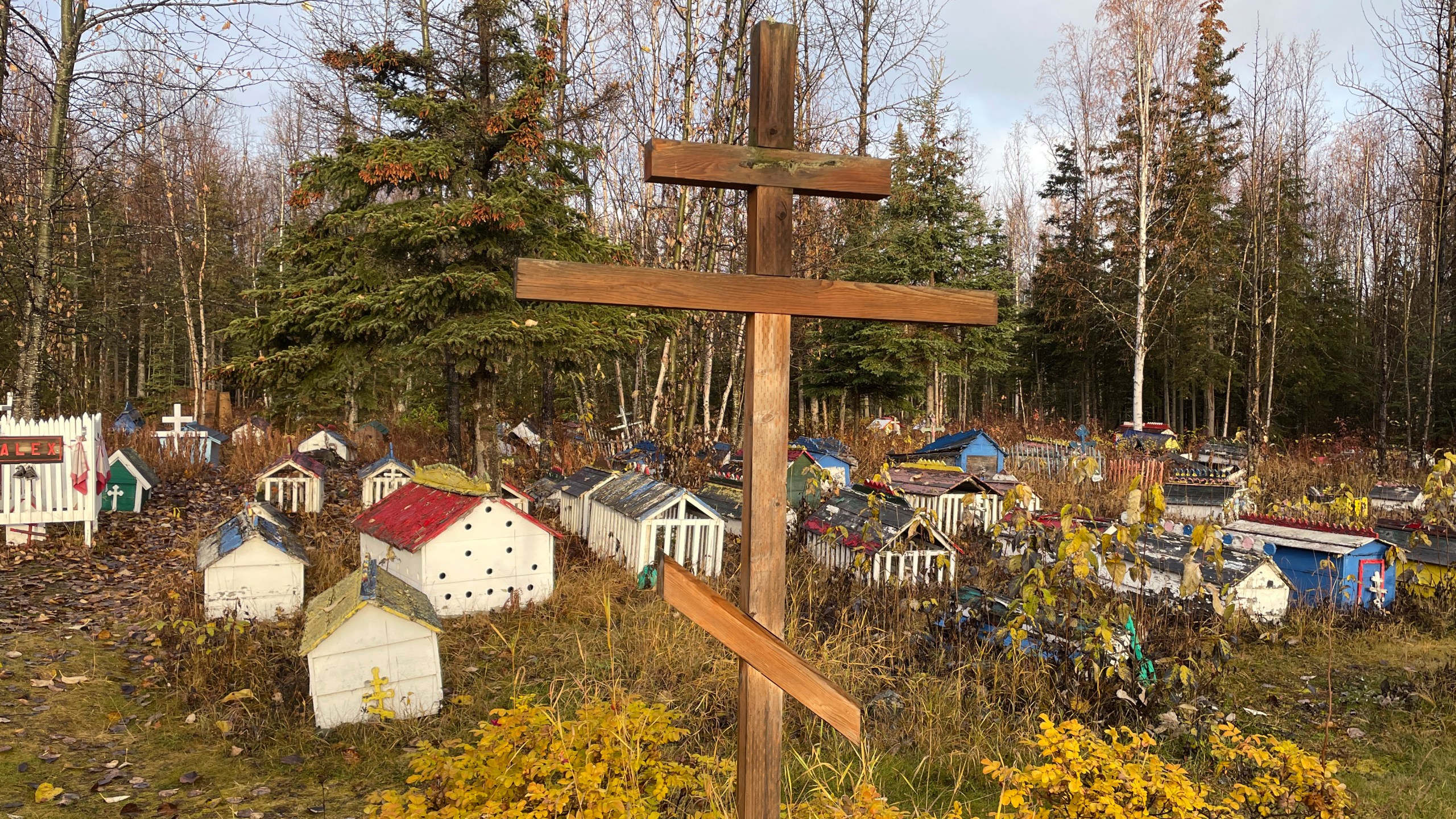 FILE - The cemetery at St. Nicholas Church in Eklutna, Alaska, features a mixture of Russian Orthodox conventions like crosses featuring three cross beams and the Dena'ina Athabascan tradition of erecting spirit homes above the graves, on Oct. 13, 2023. (AP Photo/Mark Thiessen, File)