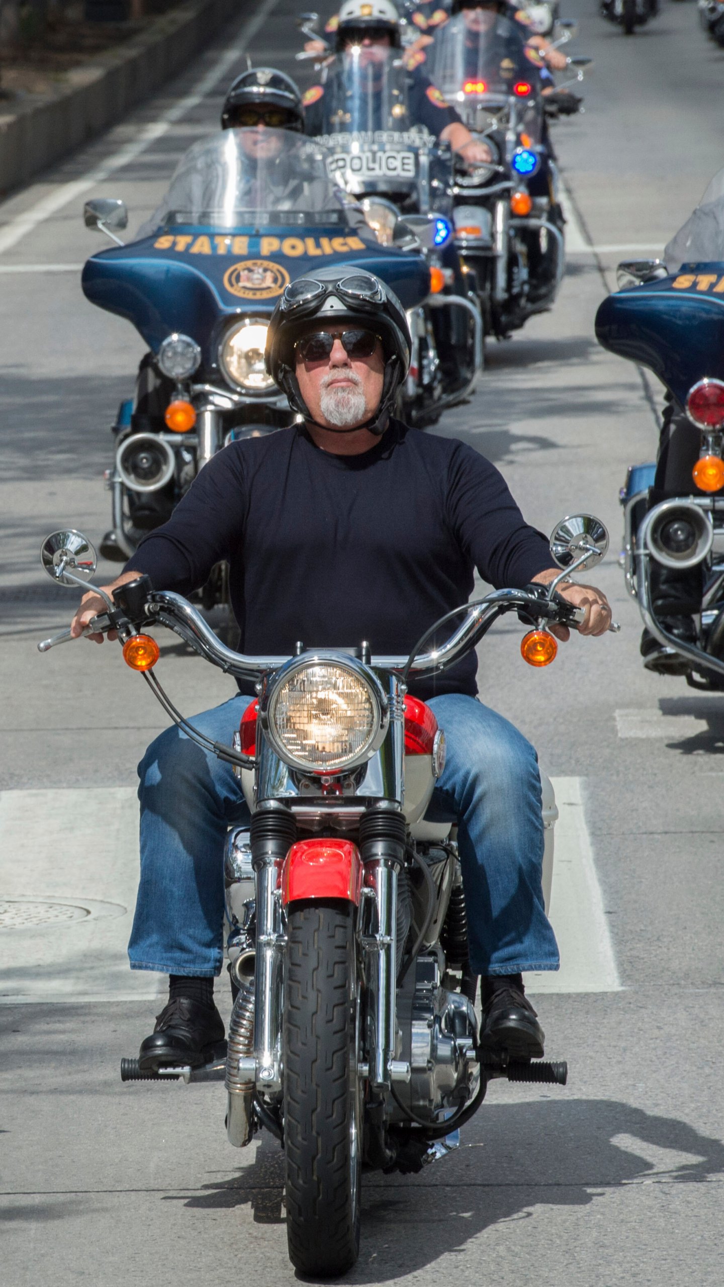 FILE - Billy Joel leads riders in the 9/11 Memorial Motorcycle Ride in New York on Sept. 11, 2015. (AP Photo/Bryan R. Smith, file)