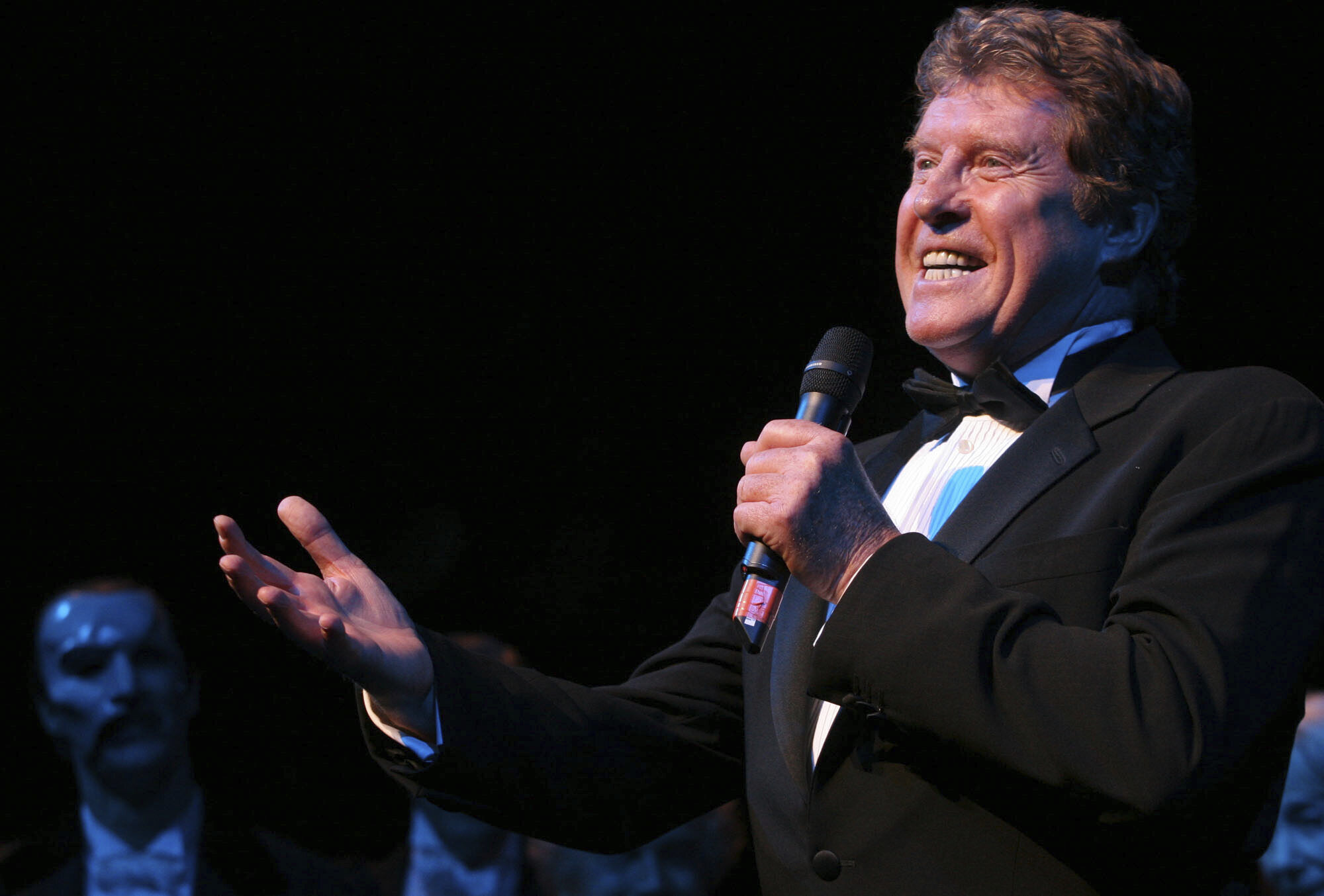 FILE - Michael Crawford, who was the original Phantom of the Opera, makes a special appearance during the curtain call following performance number 7,486 of "The Phantom of the Opera" at the Majestic Theatre in New York on Jan. 9, 2006. (AP Photo/Tina Fineberg, File)