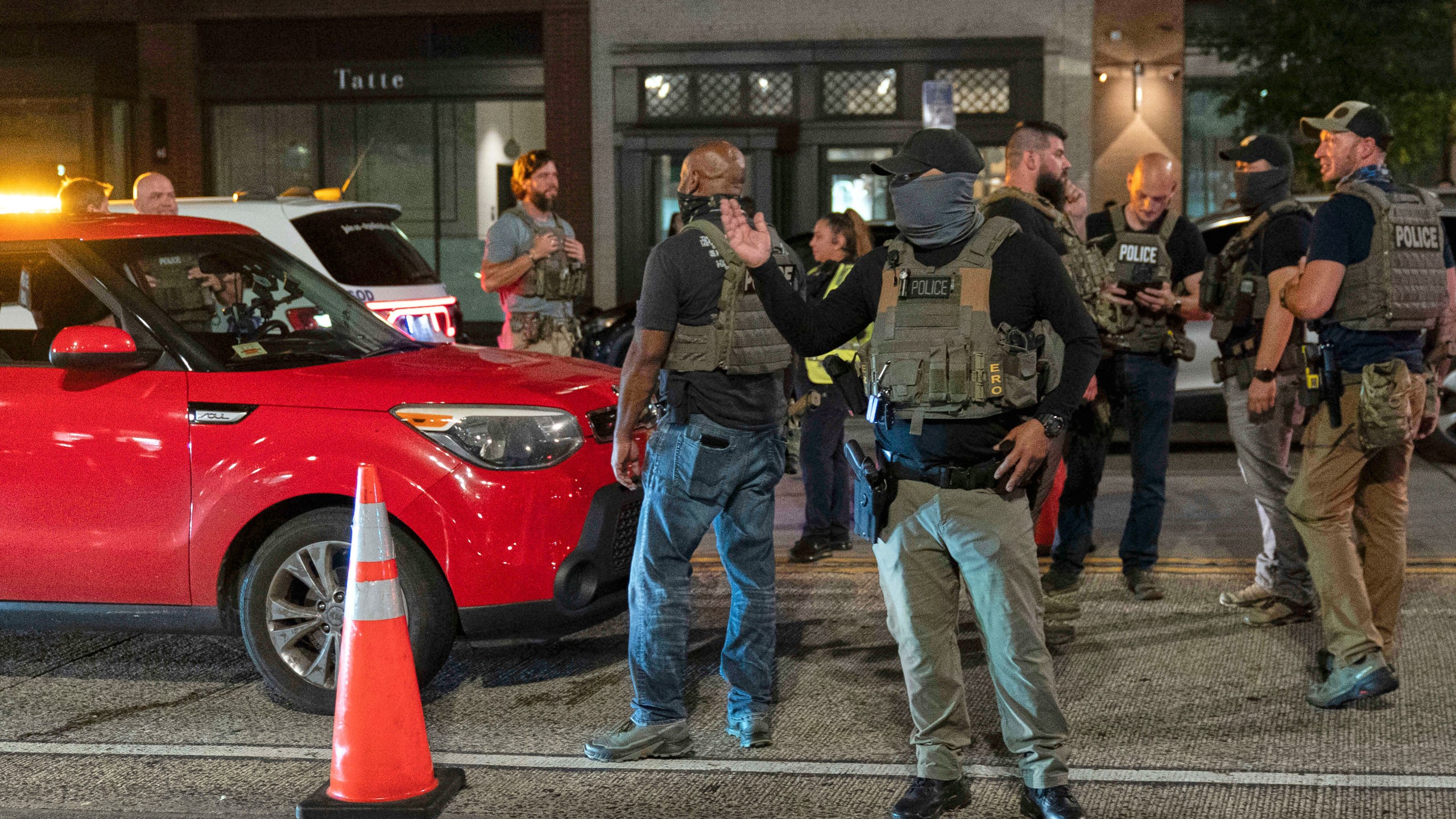 Department of Homeland Security Investigations agents join Washington Metropolitan Police Department officers as they conduct traffic checks at a checkpoint along 14th Street in northwest Washington, Wednesday, Aug. 13, 2025, in Washington. (AP Photo/Jose Luis Magana)