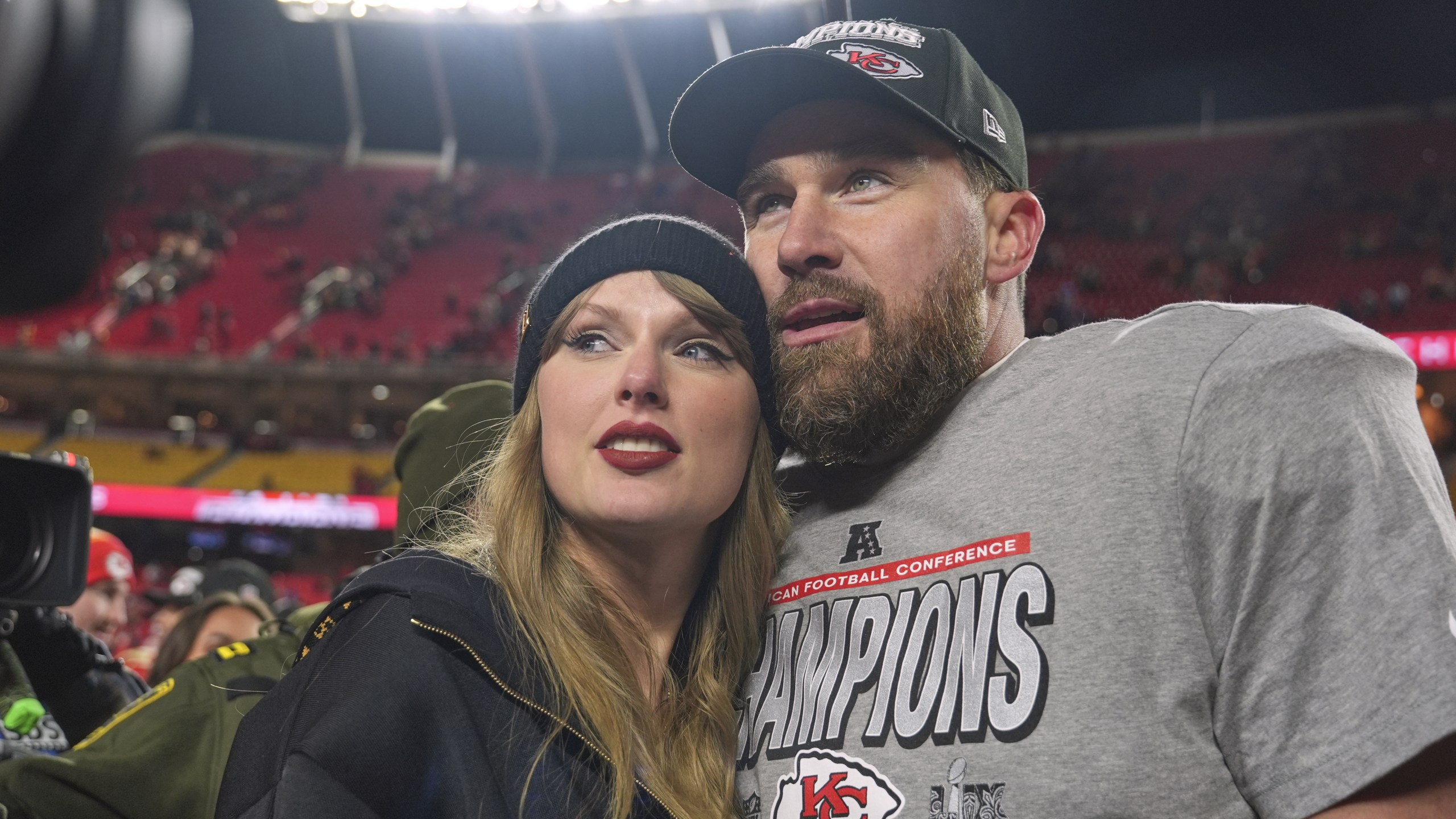 Taylor Swift and Travis Kelce embrace after a football game