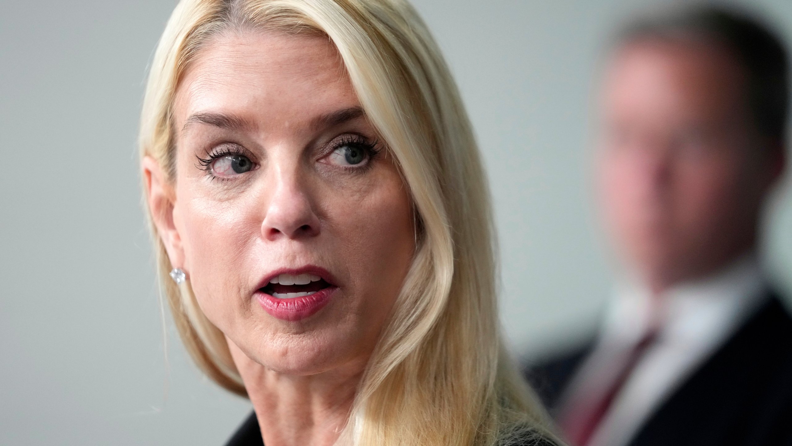 Attorney General Pam Bondi speaks with reporters during a briefing with President Donald Trump in the James Brady Press Briefing Room at the White House, Monday, Aug. 11, 2025, in Washington. (AP Photo/Mark Schiefelbein)