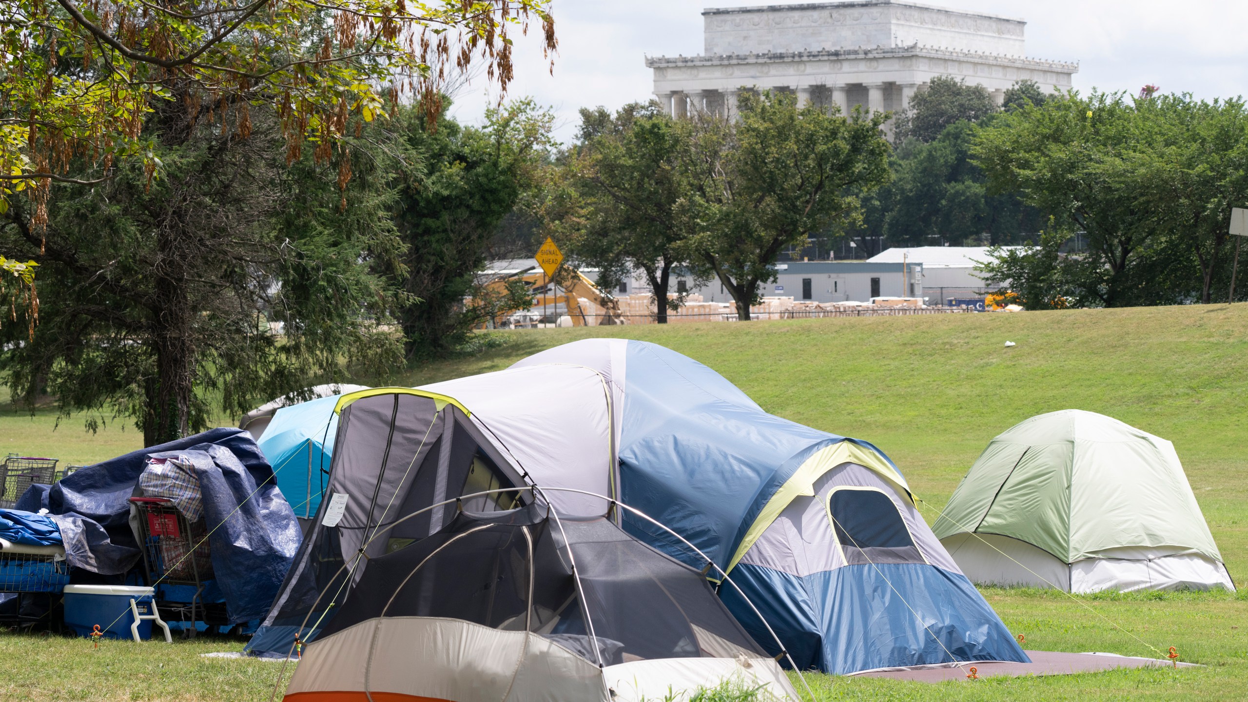 A homeless encampment is seen near the Lincoln Memorial as President Donald Trump uses federal law enforcement and the National Guard eliminate violent crime and unhoused people from the nation's capital, in Washington, Wednesday, Aug. 13, 2025. (AP Photo/J. Scott Applewhite)