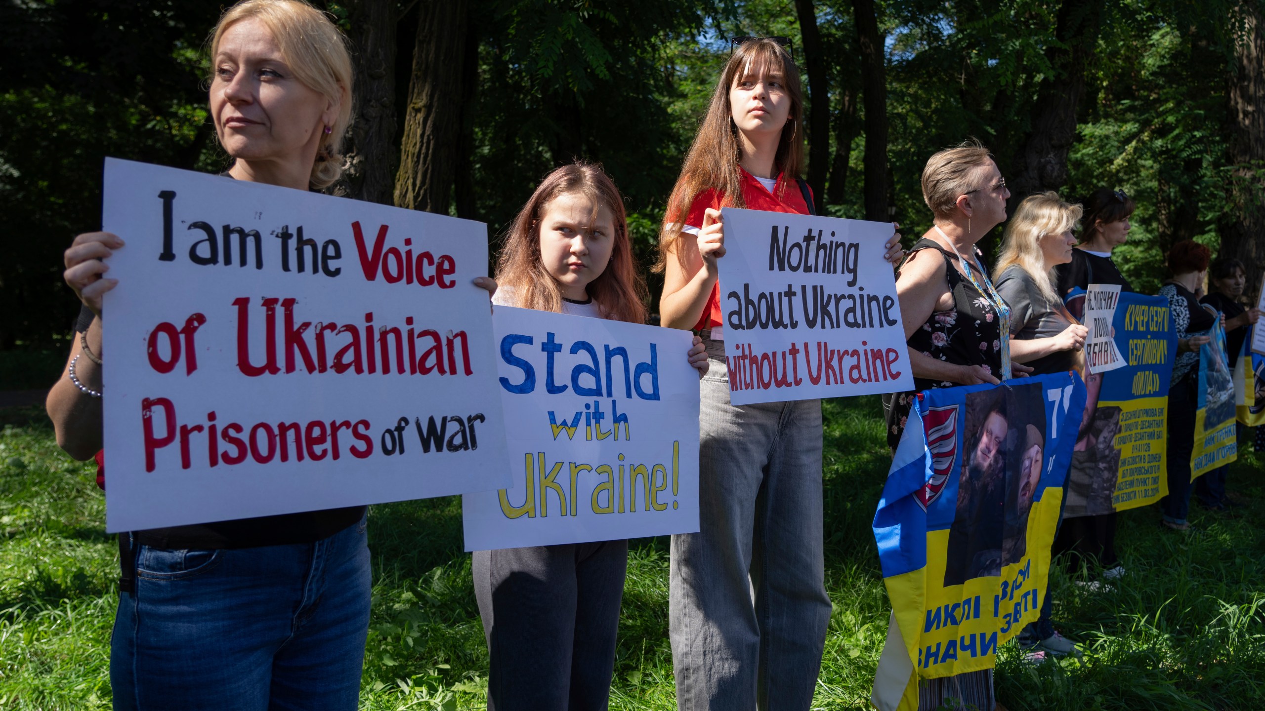People attend a rally ahead to the meeting between U.S. President Donald Trump and Russian President Vladimir Putin, during a rally in front of the U.S. Embassy in Kyiv, Ukraine, Friday, Aug. 15, 2025. (AP Photo/Efrem Lukatsky)
