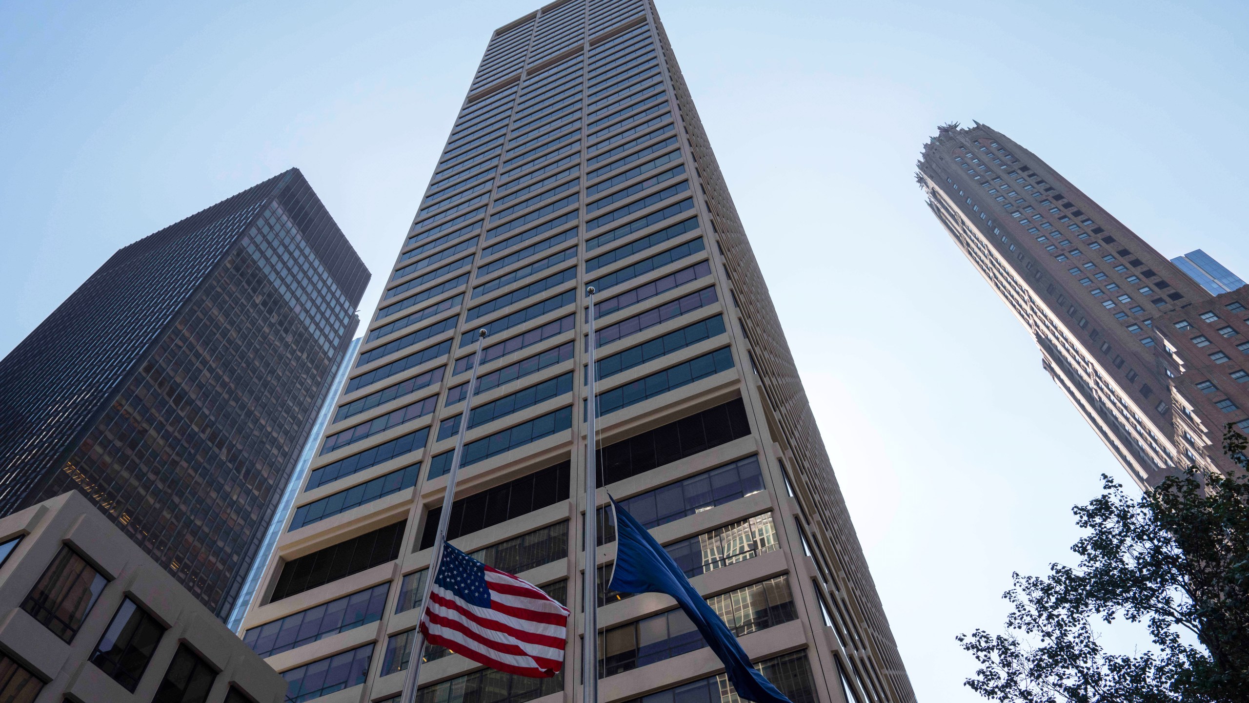 FILE - Flags fly on the exterior of 345 Park Ave on July 29, 2025, in New York. (AP Photo/Yuki Iwamura, File)