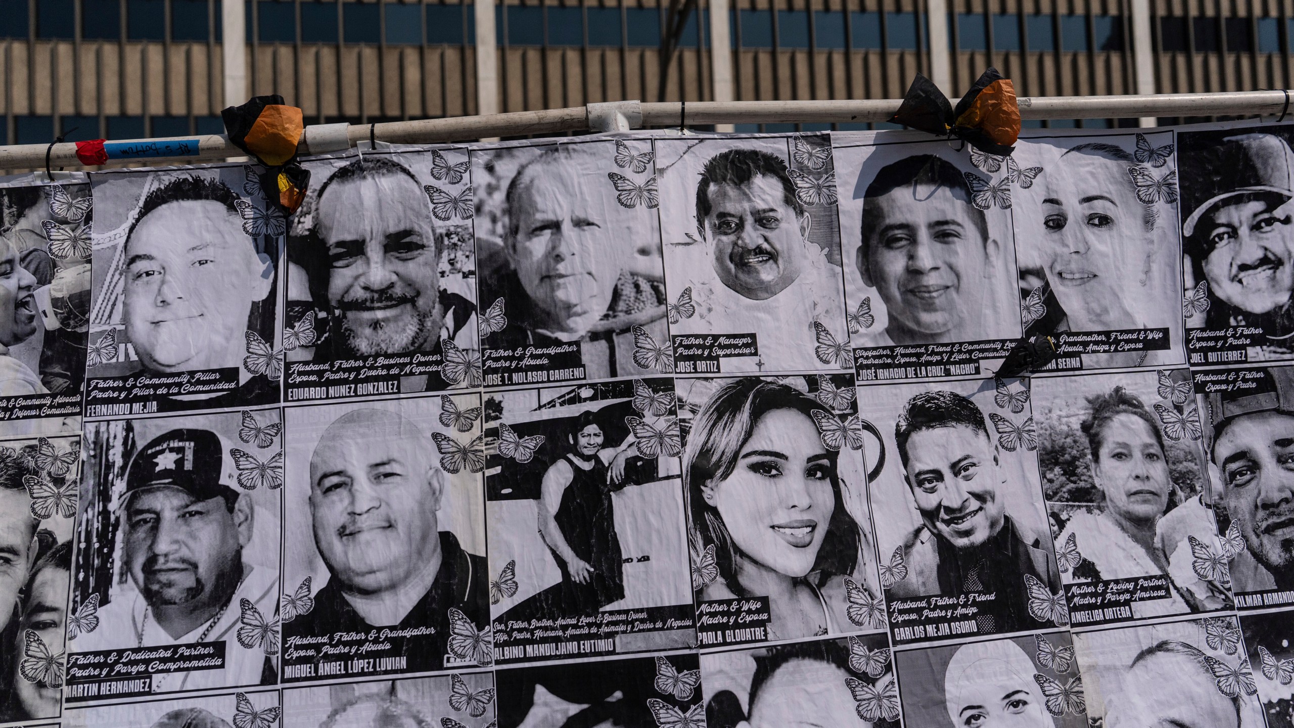 An art installation, which displays black and white images of people detained or deported as a result of ICE raids in Southern California, stands outside the federal building in Los Angeles, Thursday, July 17, 2025. (AP Photo/Jae C. Hong)