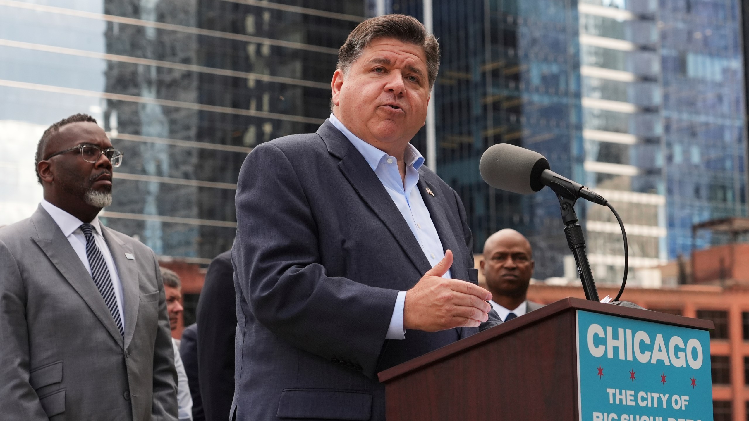 JB Pritzker speaks from a podium