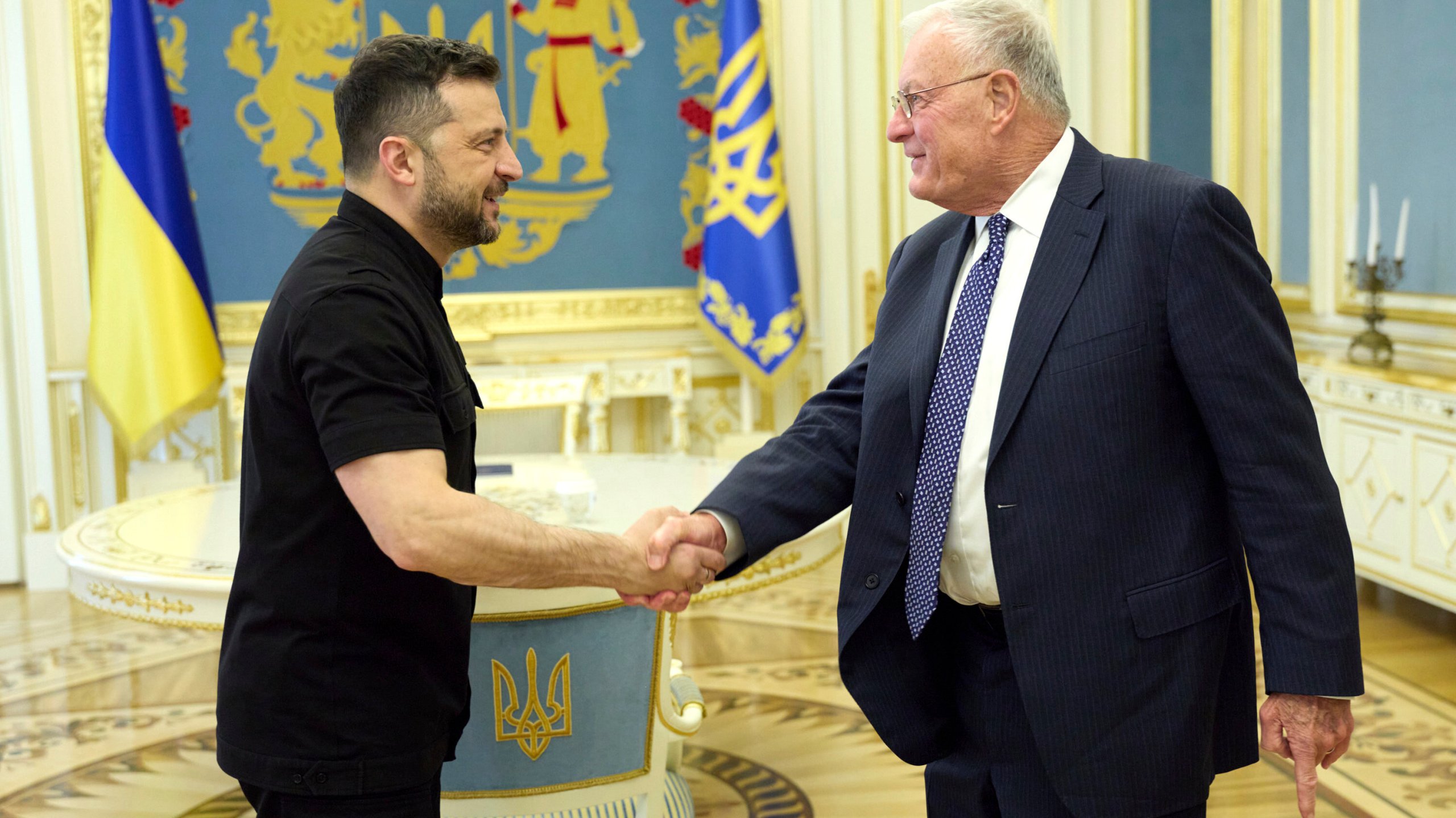 In this photo provided by the Ukrainian Presidential Press Office, Ukrainian President Volodymyr Zelenskyy, left, shakes hands with Keith Kellogg, Trump's special envoy to Ukraine in Kyiv, Ukraine, Monday, Aug. 25, 2025. (Ukrainian Presidential Press Office via AP)