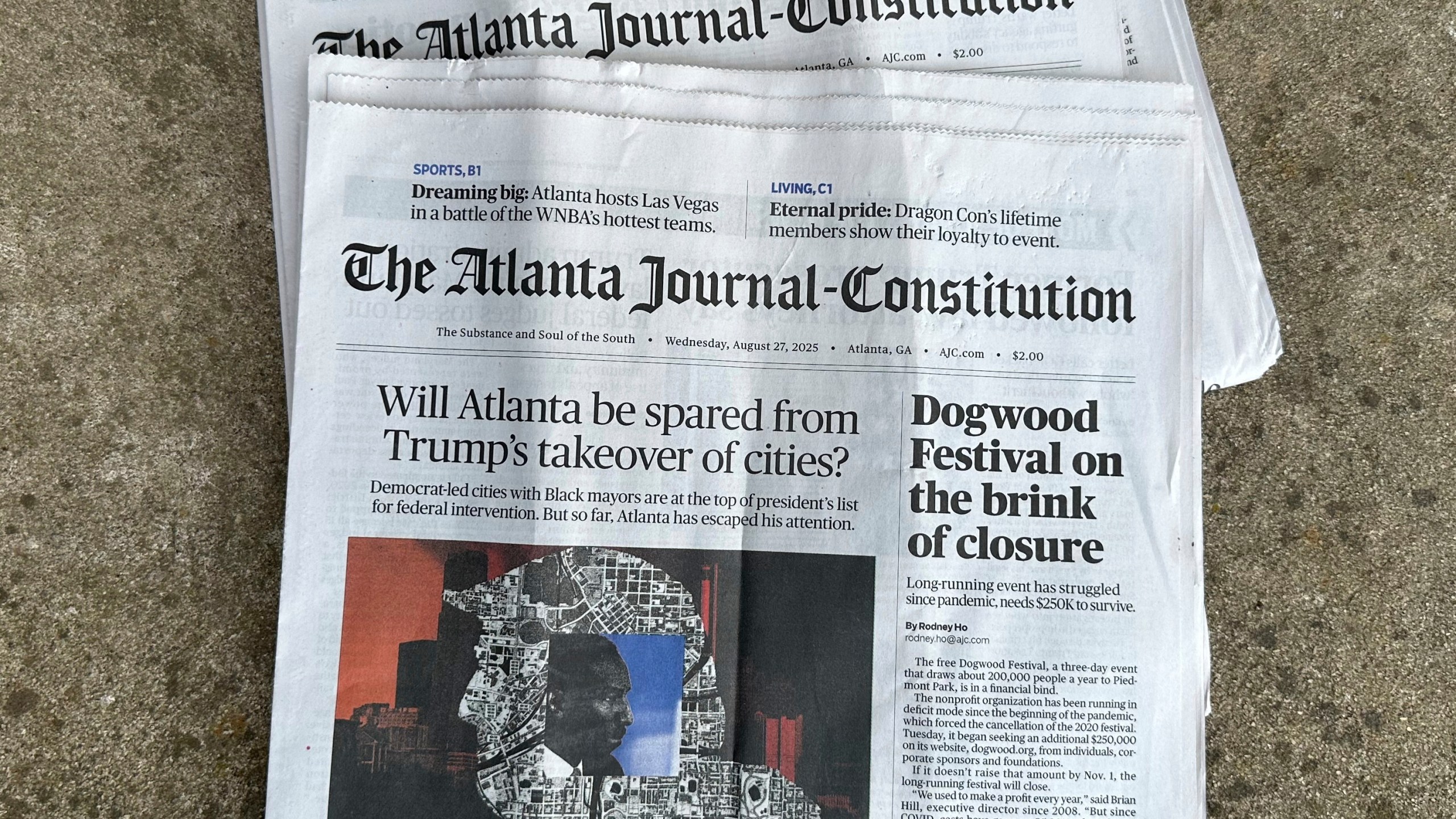 Printed copies of The Atlanta Journal-Constitution are shown on Thursday, Aug. 28, 2025, in Atlanta. (AP Photo/Jeff Amy)