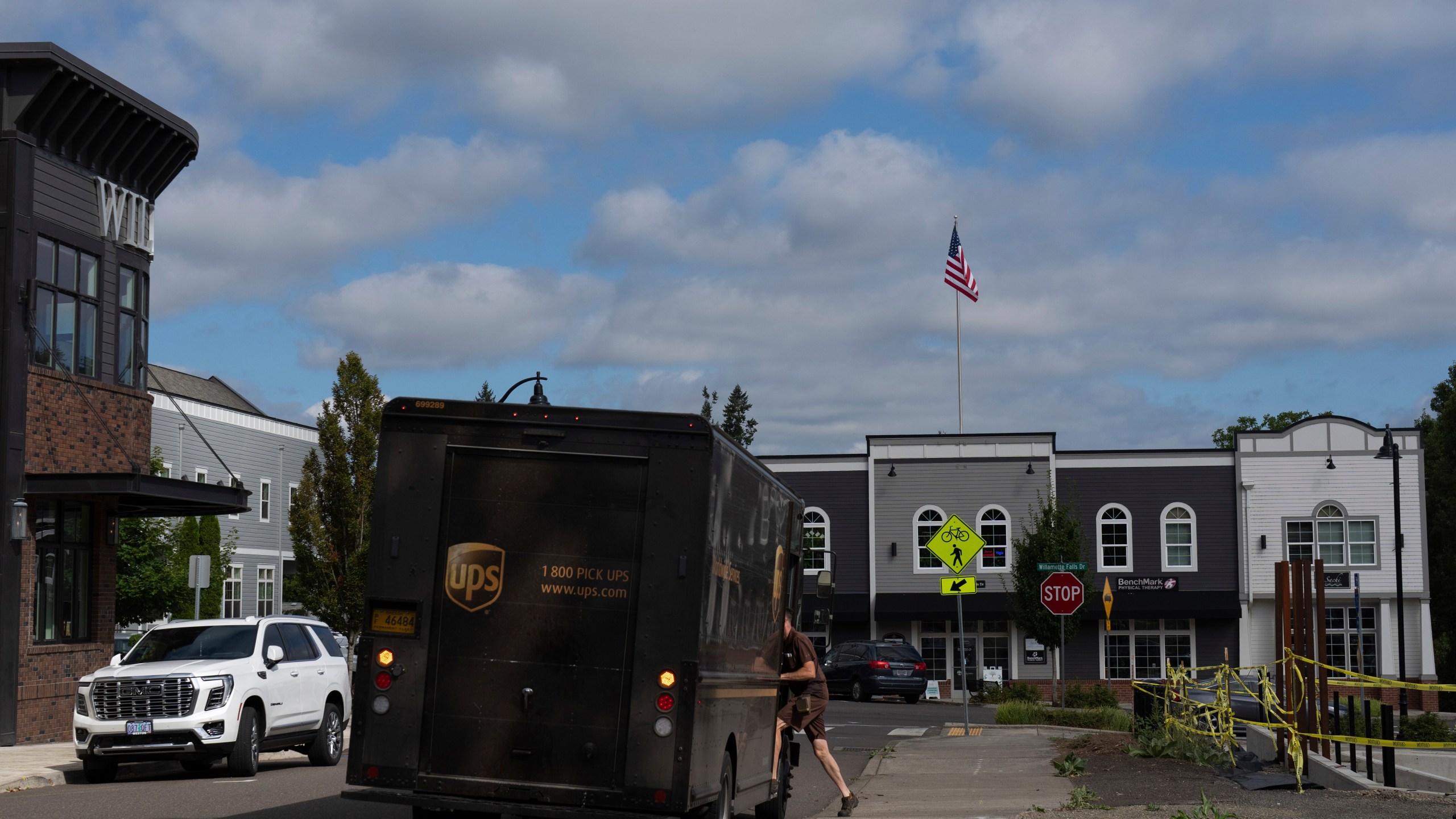 CORRECTS COMPANY NAME: A UPS driver gets into their vehicle after delivering packages at A Sight For Sport Eyes, a brick-and-mortar and e-commerce store for sport goggles, Aug. 20, 2025, in West Linn, Ore. (AP Photo/Jenny Kane)