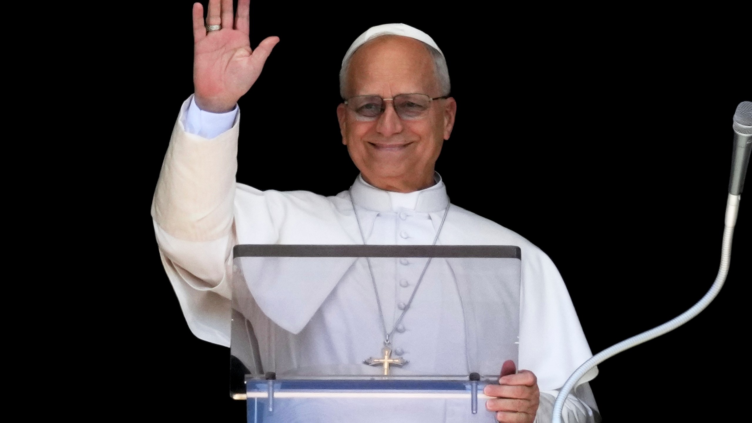 Pope Leo XIV delivers his blessing as he recites the Angelus noon prayer