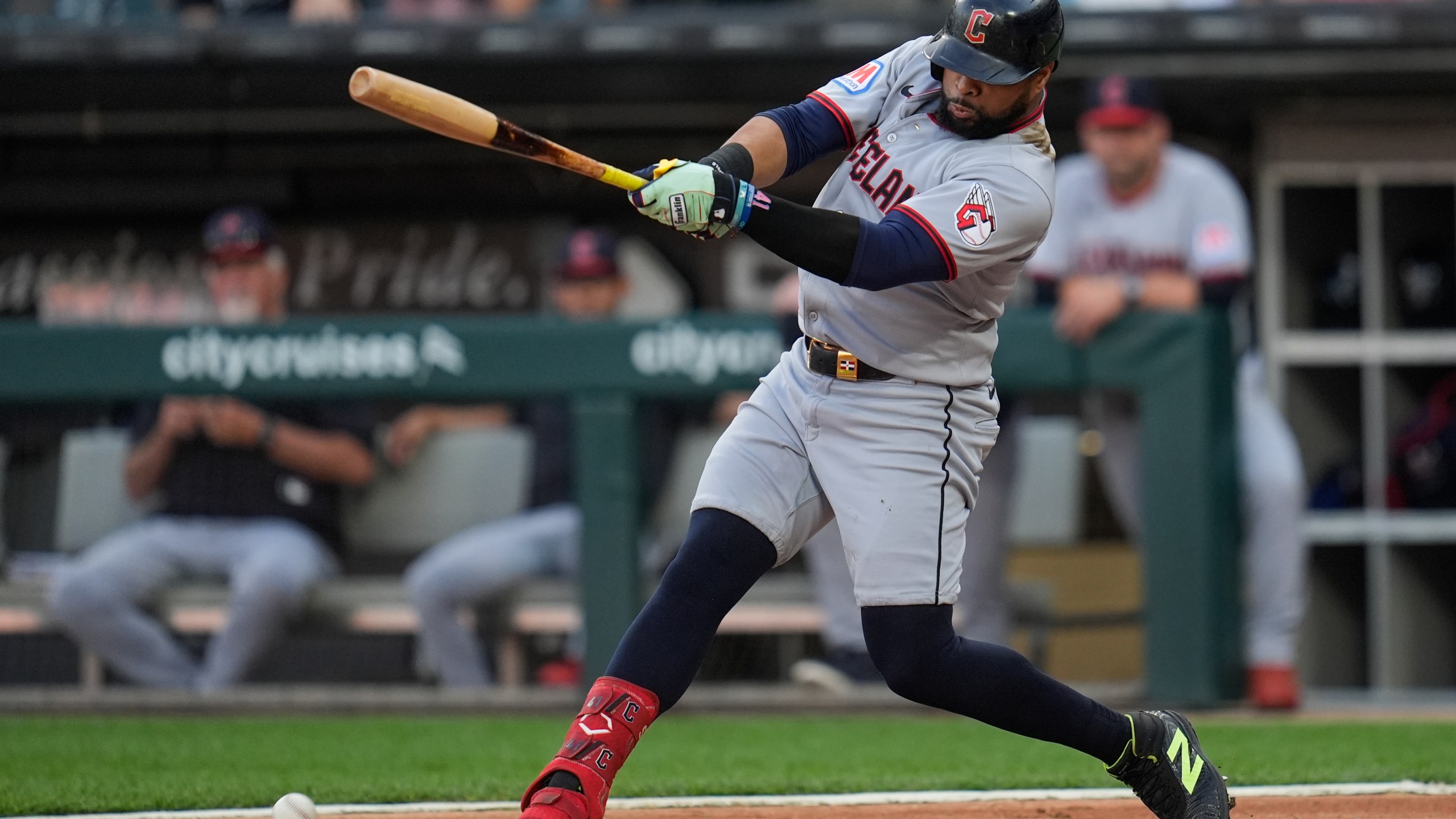Cleveland Guardians' Carlos Santana hits a two-run double during the first inning of a baseball game against the Chicago White Sox, Friday, Aug. 8, 2025, in Chicago. (AP Photo/Erin Hooley)