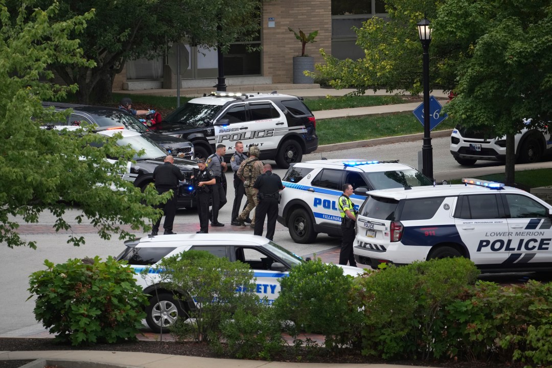 Police gather at the Villanova University campus where an active shooter was reported Thursday, Aug. 21, 2025, in Villanova, Pa. (AP Photo/Matt Slocum)