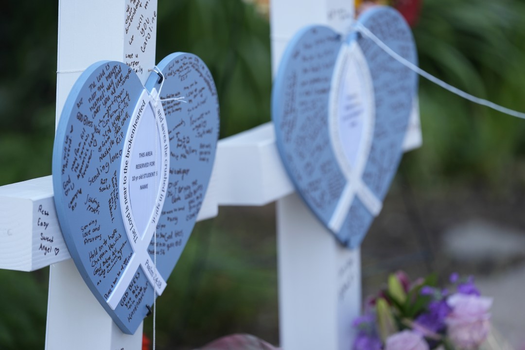Written messages are left on hearts at a makeshift memorial at Annunciation Catholic Church